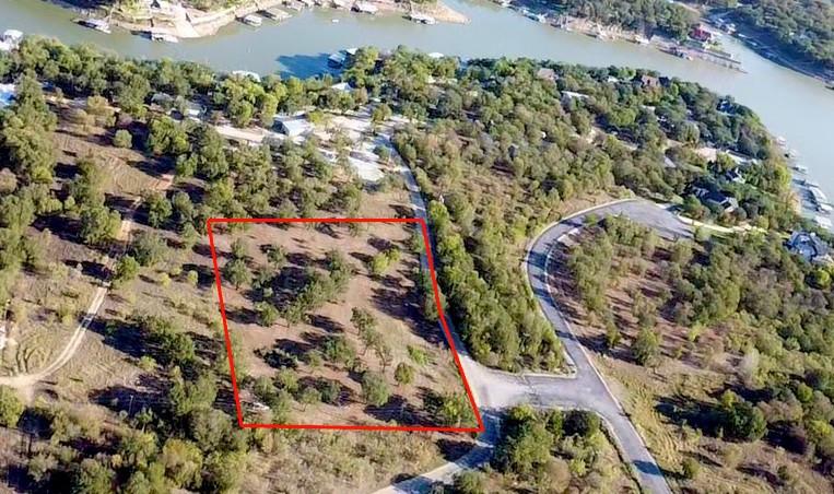 1151 Co Rd 1736 in Chico, TX is 2.5 acres of county land (NO HOA) at Lake Bridgeport. Strolling distance to North Side Marina and just outside the north entrance to Moonlight Bay HOA. Lots of mature oak trees and relatively flat land with minimal rocks. Great location to build whatever you like, home, bardo, Etc. See pictures and survey for details.