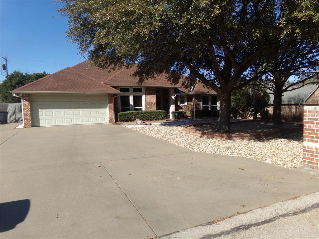 JUST REDUCED.  COME SEE TODAY.  Outstanding home.  Very well taken care of and updated.  Wood-like flooring in bedrooms and bathrooms.  Sixteen-inch ceramic tile throughout rest of home.  Shower in Primary bath has been remodeled and has tile to ceiling.  Jacuzzi tub in Primary bath has been removed for dressing area.  Plumbing has been left so jacuzzi tub can be re-installed. Refrigerator, washer and dryer to remain with property.  Very nice screen-in porch off the Breakfast area (12x14) that is shady in the evening.  Excellent landscaping in front and back yards.  Very long concrete additional driveway that owners parked two large motorhomes.