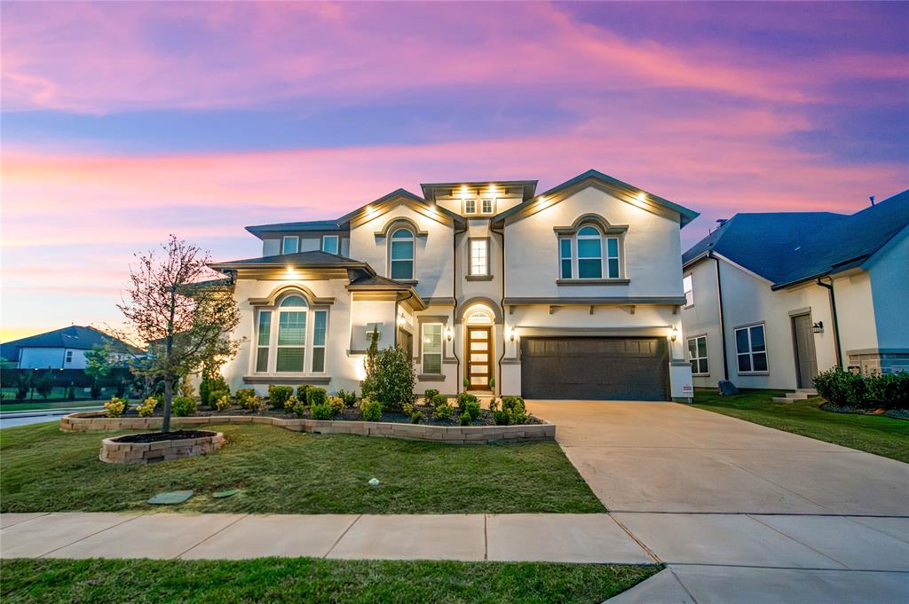 Zoned to highly sought-after Flower Mound schools, this exceptional home is located in a private gated community in Copper Canyon and offers the added benefit of a low tax rate. Ideally situated just moments from The Shops at Highland Village with easy access to FM 407 Justin Road, this location blends convenience with luxury living. Set on an east-facing corner quarter-acre lot, the home showcases stunning curb appeal with a beautiful stucco exterior, outdoor lighting, and a spacious 3-car garage. Inside, you’re welcomed by a grand staircase, a private front office with French doors, and a large living room filled with natural light from abundant windows and excellent ventilation. Thoughtfully updated throughout, the home features plantation shutters and energy-efficient elements. The kitchen is equipped with stainless steel appliances and flows seamlessly into both the formal dining room and bright breakfast area. The downstairs primary suite offers a true retreat with an updated bath, separate tub and shower, and two walk-in closets—one with an additional access door for extra storage. A secondary bedroom downstairs provides flexibility for guests or multi-generational living, while the utility room adds character with stylish checkered tile. Upstairs, enjoy a spacious game room, media room, two additional bedrooms, and a full bath. The backyard is perfect for relaxing or entertaining, complete with a covered patio for year-round enjoyment.
