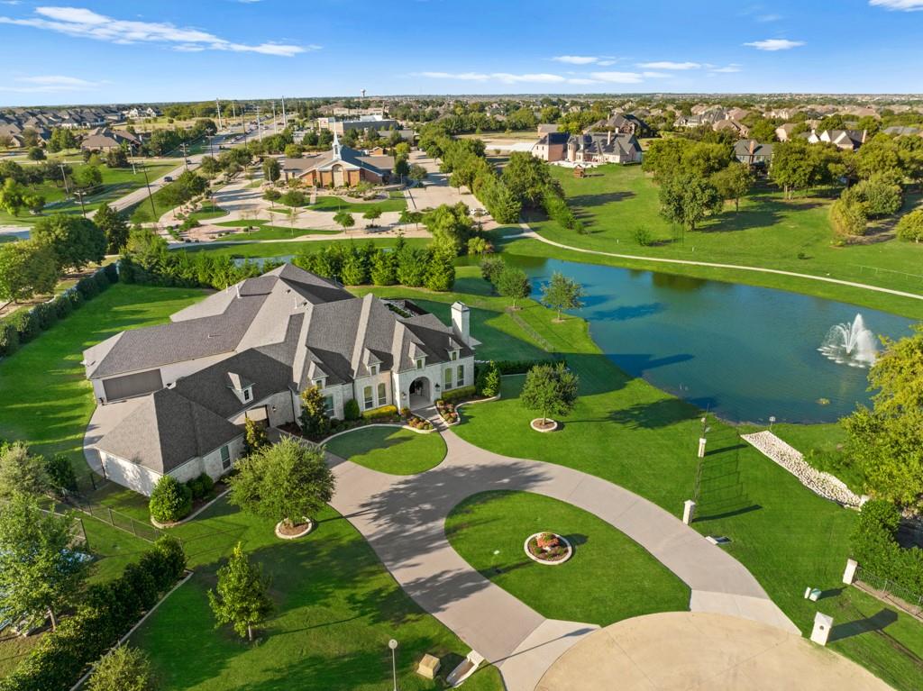 Absolutely STUNNING Luxury SINGLE story Custom home located in the Prestigious Gated community of The Enclave Whispering Farms, residence to ONLY 14 homes offers privacy, safety! This Elegant home showcases the perfect blend of luxury and comfort, a layout that effortlessly flows making it ideal for entertaining. The CAPTIVATING Great room is a seamless spacious area including Kit with Wolf appliances, sub-zero, extensive cabinetry, 9x5 island, add'l space for a very lg dining table, flowing into the expansive FamRm, floor to ceiling stone FP, all overlooking 873sf covered patio, Claffey infiniti edge pool, and a Pond view as your final backdrop to Resort Style Luxury! Outdoor area Includes Grill, sink, Yoder 640 smoker, FP, 3 ceiling heaters. Inside, don’t miss the Butlers Pantry w Scotsman Nugget Ice, 40 bottle wine fridge; Primary suite incl 2nd off-season closet, Safe Room; GameRm incl 120in TV-Projector, Bar w-mini frdge. So much more. Live the dream in this luxurious home.