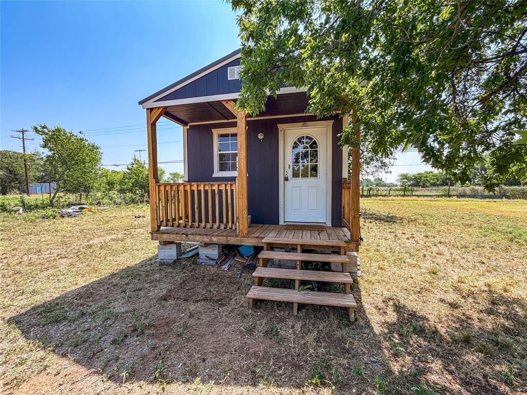 Opportunity awaits with this versatile property located on Avenue D in Haskell. Situated on a spacious lot, this property features a newly constructed tiny home that serves as the perfect efficiency-style residence, offering comfortable, low-maintenance living with modern finishes and thoughtful design. Whether you're searching for a starter home, downsizing option, weekend retreat, or investment property, this charming tiny home is ready to meet your needs. The generously sized lot provides ample room for future expansion, additional improvements, parking, or outdoor living spaces. With excellent visibility and a convenient location, the property also offers endless possibilities for a variety of residential, rental, or business-related uses, making it a unique and flexible investment opportunity in the heart of Haskell.