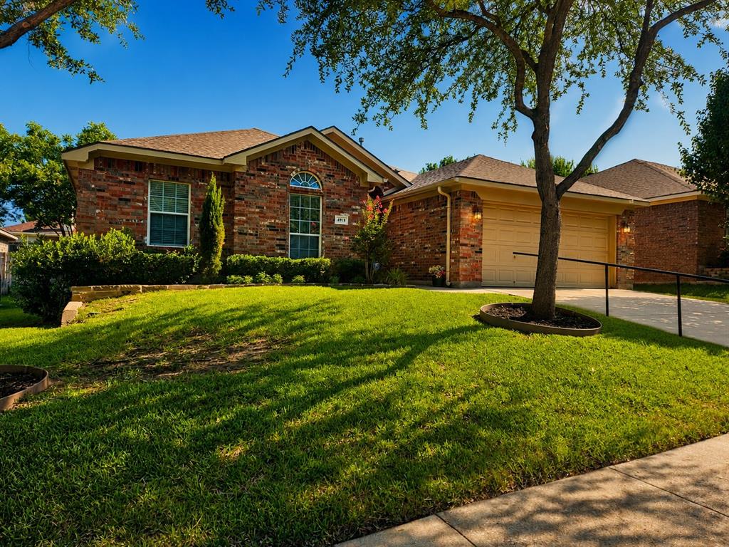 Welcome to this beautifully maintained just two owner home where pride of ownership is evident inside and out. From the moment you arrive you will appreciate the outstanding curb appeal with lush landscaping, a manicured lawn, mature trees, and a brand-new wood privacy fence creating an inviting outdoor setting. This thoughtfully designed home offers comfortable one story living with beautiful wood look tile flooring throughout the main living areas providing both elegance and easy maintenance. The spacious living room is filled with natural light and opens seamlessly to the kitchen and dining area creating an ideal layout for everyday living and entertaining. The kitchen features abundant cabinetry, generous counter space, a large island, pantry, and stainless-steel appliances with the refrigerator conveying to the new owner. The primary suite offers built in cabinetry providing exceptional storage and organization while the secondary bedrooms are generously sized. Designed with accessibility in mind this home includes handicap friendly amenities throughout making daily living more convenient and comfortable. Major updates provide outstanding peace of mind including a new roof installed in 2025, a brand new HVAC system installed in 2026, updated sprinkler controls that have been professionally verified to be in excellent working condition, and a new wood privacy fence. The security alarm system also conveys with the home. Step outside to enjoy the covered, open patio, and spacious backyard that is perfect for relaxing, entertaining, gardening, or family gatherings. An insulated storage building with electricity offers endless possibilities as a workshop, hobby room, studio, or additional storage space. Conveniently located near shopping, dining, parks, schools, and major commuting routes, this exceptional move in ready home combines quality updates, accessibility, comfort, and timeless appeal in one beautiful package. A rare opportunity you will not want to miss.