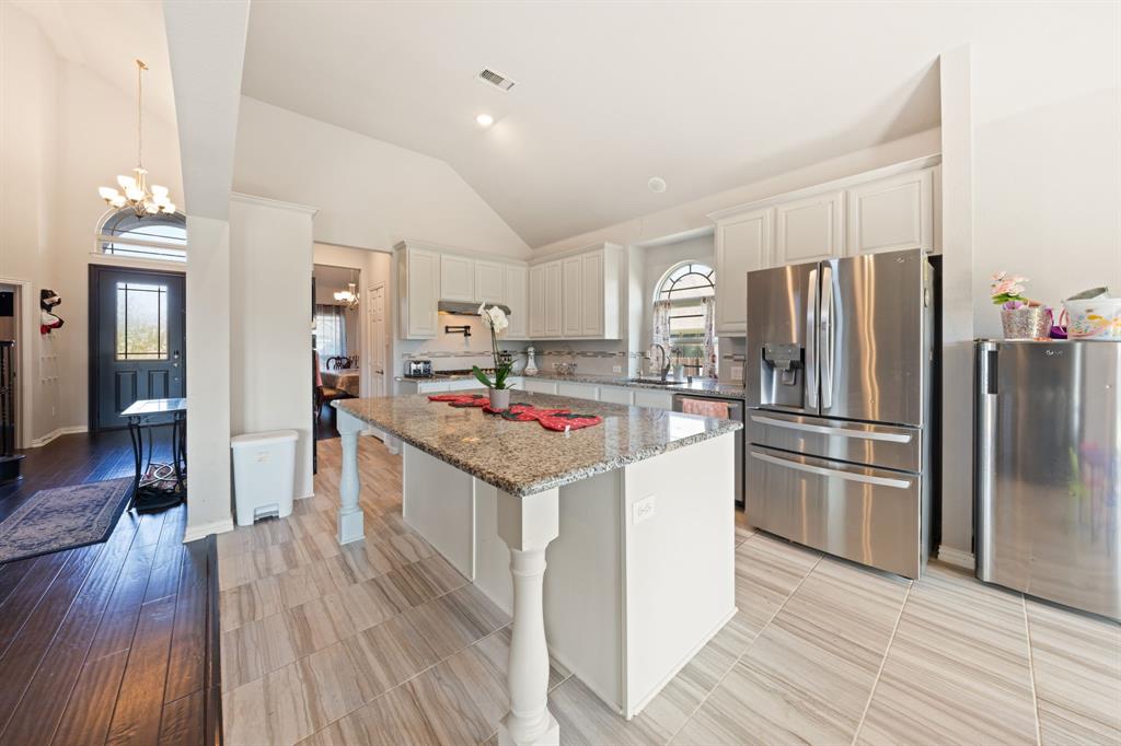 Welcome to 264 Northstar, where versatility is one of the home's greatest strengths. Offering 3,327 square feet, 4 bedrooms, and 4 bathrooms, this thoughtfully designed home provides the flexibility today's buyers are searching for. Whether you need space for remote work, entertaining, hobbies, guests, or a growing household, this floor plan adapts to your lifestyle. The dedicated office creates a quiet workspace away from the main living areas, while the fully equipped media room offers endless possibilities for movie nights, gaming, fitness equipment, a playroom, or additional gathering space. At the heart of the home, the open-concept kitchen, dining, and living areas create a natural hub for everyday life. The kitchen features a butler's pantry, a large island with seating, and abundant counter space, making meal preparation and entertaining effortless. The adjoining living room is filled with natural light and anchored by a cozy fireplace that adds warmth and character to the space. The primary suite offers a relaxing retreat with new carpet, a spa-inspired ensuite bath featuring a soaking tub, separate shower, dual vanities, and a spacious walk-in closet. The secondary bedrooms are generously sized and positioned to provide comfort and privacy for family members or guests. A Dupure whole house water filtration system adds convenience and quality throughout the home. Outside, the timeless brick exterior creates lasting curb appeal, while the backyard offers room to relax and enjoy the outdoors with the added benefit of alley access behind the property. Conveniently located near schools, shopping, dining, and everyday amenities, this home combines space, functionality, and flexibility in one attractive package. For buyers seeking a home that can evolve with changing needs while still providing comfort and style, 264 Northstar delivers an exceptional opportunity in the heart of Waxahachie.