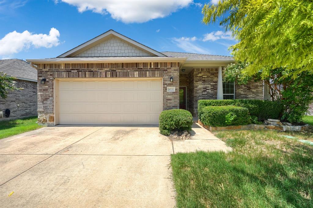 CHARMING SINGLE-STORY HOME IN TRAILS OF FOSSIL CREEK
Welcome to this beautifully maintained residence blending modern functionality with exceptional curb appeal in North Fort Worth. Boasting a highly desirable single-story layout with nearly 1,940 square feet of inviting interior space, this 3-bedroom, 2-bathroom home features soaring ceilings and a thoughtful split floor plan that fills the open spaces with an abundance of natural light.

Step past the welcoming front porch into bright interiors showcasing fresh interior paint and brand-new, beautiful wood floors running throughout the primary living areas. The gourmet chef’s kitchen serves as the heart of the home, fully equipped with premium granite countertops, 42-inch upper cabinets, a spacious pantry, and a large central breakfast bar. The kitchen flows seamlessly into an expansive open-concept living room centered around a cozy wood-burning stone fireplace, making it the perfect focal point for entertaining. An additional flex space offers the perfect opportunity for a private home office, guest area, or formal dining room tailored to your specific needs.

Retreat to the private primary suite, complete with a massive walk-in closet and a spa-like bath featuring dual vanities, a soaking tub, and a separate shower. The secondary bedrooms are generously sized with ample closet space. Step outside to enjoy Texas evenings under your private covered patio overlooking a pristine, well-kept flat backyard. An attached front-facing two car garage provides excellent storage and parking utility. Residents enjoy premier neighborhood perks including a community pool, walking trails, and parks, with elite Northwest ISD school zoning. Conveniently located near shopping, dining, and major highway links.