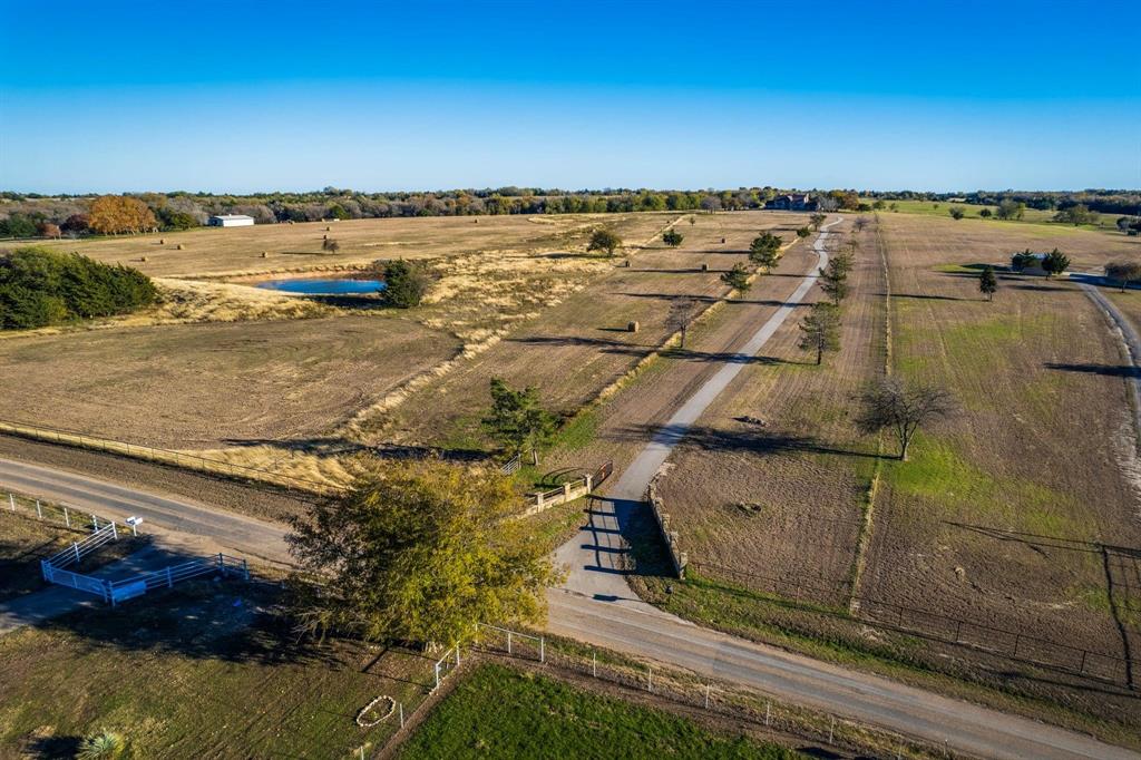 Enjoy breathtaking views of distant skylines, a peaceful creek to explore, and ample acreage to bring your vision to life. This 36.08-acre property sits atop a scenic hill, offering stunning vistas and serene surroundings. Featuring a pond, a seasonal creek, and abundant trees, this land is a true retreat. Nestled on the outskirts of Maypearl, it provides a quiet, secluded setting.

With plenty of open space, this property is ideal for a variety of uses, whether you’re looking to build your dream home, establish a weekend getaway, or create a recreational retreat. The gently rolling terrain adds character, while the mix of open pasture and wooded areas offers versatility. The seasonal creek meanders through the land, enhancing the natural beauty and providing a picturesque backdrop.

Currently Ag-exempt and producing hay, this property offers low taxes and great potential for agricultural use. Whether you're seeking privacy, room to roam, or an investment opportunity, this land is a rare find.