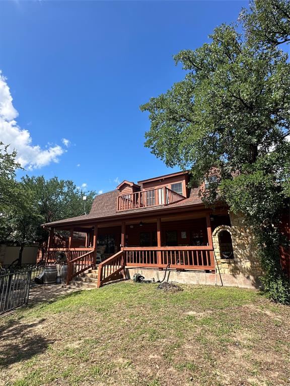 FANTASTIC OPEN WATER LAKE RETREAT IN GATED OAK POINT, JUST MINUTES FROM BROWNWOOD! OPEN CONCEPT WITH 3 LIVING AREAS, LOFT AREA WITH BALCONY. SO MANY GREAT ENTERTAINING SPACES, INSIDE-OUT! INCREDIBLE VIEWS OF OPEN WATER AND BEAUTIFUL LOT!HEATED & COOLED GARAGE USED FOR CONVERTED BUNK & GAME ROOM WITH ADDITIONAL PRIVATE BEDROOM AND FULL BATH CAN SLEEP & ENTERTAIN FAMILY AND FRIENDS! USE OF ZEPHER WATER METER PAID. BUYER RESPONSIBLE FOR CONNECTION TO NEW LINE UNDERWAY. UNTIL THEN, WATER FILTRATION SYSTEM IN PLACE. COVERED PORCH WITH FIREPLACE. DOCK WITH HYDRO-HOIST, JET SKI SLIP, STORAGE!SEPARATE GARAGE, STORAGE. BEST LAKE LIFE RIGHT HERE! PLENTY OF GUEST & BOAT PARKING. DOCK ACCESSED BY STAIRS OR SLOPED WALKWAY. FENCED YARD.
