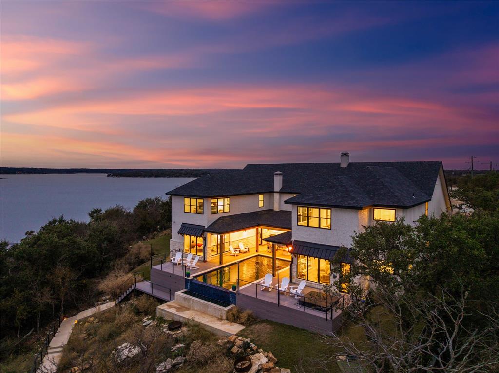 SPECTACULAR 2024 BUILDER'S DREAM WATERFRONT RETREAT IN GATED OAK POINT! 6 BED, 5 BATH, 1 HALF BATH! DOWNSTAIRS-3 LUXURY SUITES! PRIMARY WITH INCREDIBLE SPA-INSPIRED BATHROOM. UPSTAIRS-3 SPACIOUS GUEST SUITES & BATHROOMS. INCREDIBLE LAKE VIEWS THROUGHOUT! SOARING CEILINGS, SPRAYED INSULATION, BEAUTIFUL WOOD & TILE FLOORS. GRANITE, GREAT ROOM OPEN TO KITCHEN OFFERS TABLE SEATING FOR 21 PLUS! IN-GROUND POOL, FIRE PIT, HOT TUB, PATION GRILL, ADDITIONAL UNDER DECK STORAGE! DOCK WITH 2 HYDRO-LIFT & SWIM OUT. SUPER WATER LOCATION! PRIVATE WATER SYSTEM IN PLACE. ZEPHYR WATER SYSTEM AVAILABLE. ROAD PAVING PLANNED.