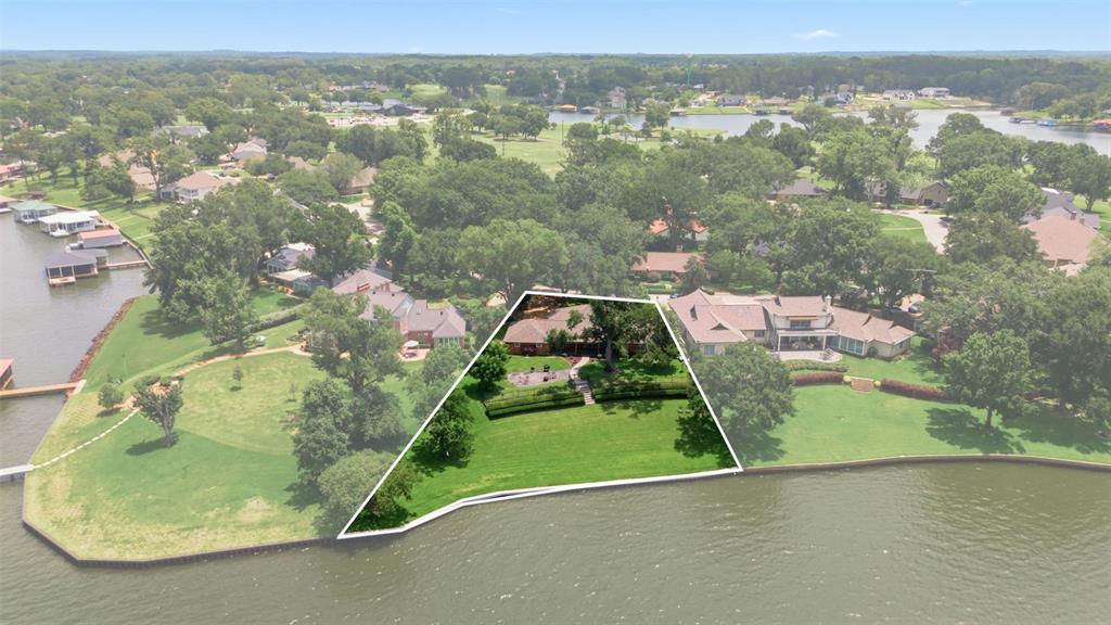 Emerald Bay is truly one of the premier communities in East Texas. Located in Bullard, along Lake Palestine, this is a gated community with a championship 18 hole golf course, club house, swimming pool, tennis, pickleball courts, basketball court and fishing. This home, built in 1979 and COMPLETELY remodeled in 2017 and many addtional updates made since. Somany upgrades to note; please see the list in the additional documents. This home sits on one of the best lots in thecommunity. Enter into the circle driveway with mature trees and landscaping beckoning you into the home. Open waterviews with 162' of water frontage, enjoy the breeze off the water as you enjoy the sunsets! Immaculately cared for, this 3bedroom, 2 bath, 3107 sq ft home is a joy to live in with a large open living, dining and kitchen area. The master bedroomhas views of the lake, a luxurious bathroom rivaling a high end spa and a closet to be envied. The covered deck offers great opportunity to enjoy the view and the outdoors and the garden area allows for an additional seating area for outdoorentertainment. The yard extends down towards the water for additional space to enjoy the scenery. Brand new bulkhead extends the length of the waterfront. 2 car garage with an extra garage space for your golf cart and a shop area.