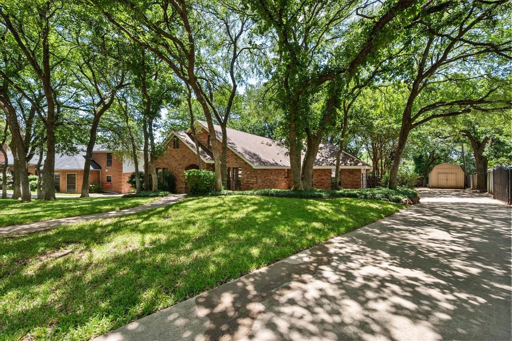 Amazing FIVE bedroom home in Established Huntwick Estates feeding to great Arlington schools. This property has so many features, including 2 dining areas and 2 living. The layout is ideal with the primary bedroom split from two secondary bedrooms on the first floor. All rooms are generously sized. The kitchen comes complete with granite countertops, double oven, newly installed tile, desk area and a large pantry. The eat-in dining area overlooks the livingroom featuring a wood burning fireplace. Also, a wall of windows allows for natural light to flow in with beautiful views of the backyard and sparkling pool. The primary bedroom is private and also large with an updated on-suite bathroom. His and hers closets are functional. The entryway has a oversized closet perfect for any kind of storage. Upstairs, one is greeted by a great room which can be perfect for media, extra living or play space. A big bonus is the kitchenette! Imagine all the entertaining in that space! The great room divides the 2 generously sized bedrooms upstairs. A full bathroom accomodates the 2nd floor rooms. Once again, a door from the bathroom reveals another large storage space. The show stopper is the backyard! Since the back of the house faces south, there is no exposure to the glaring east and west sun. A covered porch is perfect for lounging and cooking out while enjoying the pool. Speaking of pool, it was resurfaced in 2026. There is plenty of room for outdoor furniture such as a place to dine, lay-out or just sitting and enjoying the view. The backyard is so spacious and backs up to a creek making it feel like you aren't in the city. So quite and serene. Another perk is the extra parking in the back and side for recreational vehicles. A large shed is perfect for lawn and pool equipment. The private drive to the side entry garage creates safety. Updates include fresh interior and exterior paint, kitchen tile, 1 HVAC system, upstairs shower insert. A special place to call home!