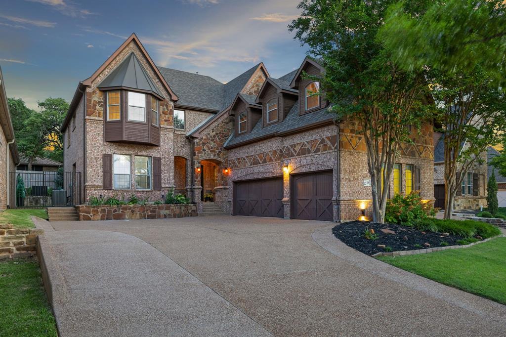 Nestled within the prestigious, guard-gated Villas of Hogan’s Glen, this meticulously crafted home offers luxury and privacy. Spanning over 4,000 square feet, the residence boasts 4 bedrooms, 4.5 bathrooms, and an array of high-end finishes. The gourmet kitchen is a chef’s dream, featuring an oversized island with a prep sink, double ovens, a Viking refrigerator, walk-in pantry, butler’s pantry, and a built-in wine cellar. Hand-scraped hardwood floors flow seamlessly throughout the main living areas, complemented by vaulted ceilings and decorative lighting.The expansive owner’s retreat offers a serene escape, while the upstairs game and media rooms provide ample space for entertainment. The low-maintenance backyard is designed for relaxation, complete with a cozy patio and outdoor fireplace. Additional highlights include a 3-car garage, his and hers closets.  Residents enjoy access to private lakes, hiking and biking trails. Conveniently located near Hwy 114, shopping, and dining, this home exemplifies the epitome of refined living in Trophy Club.