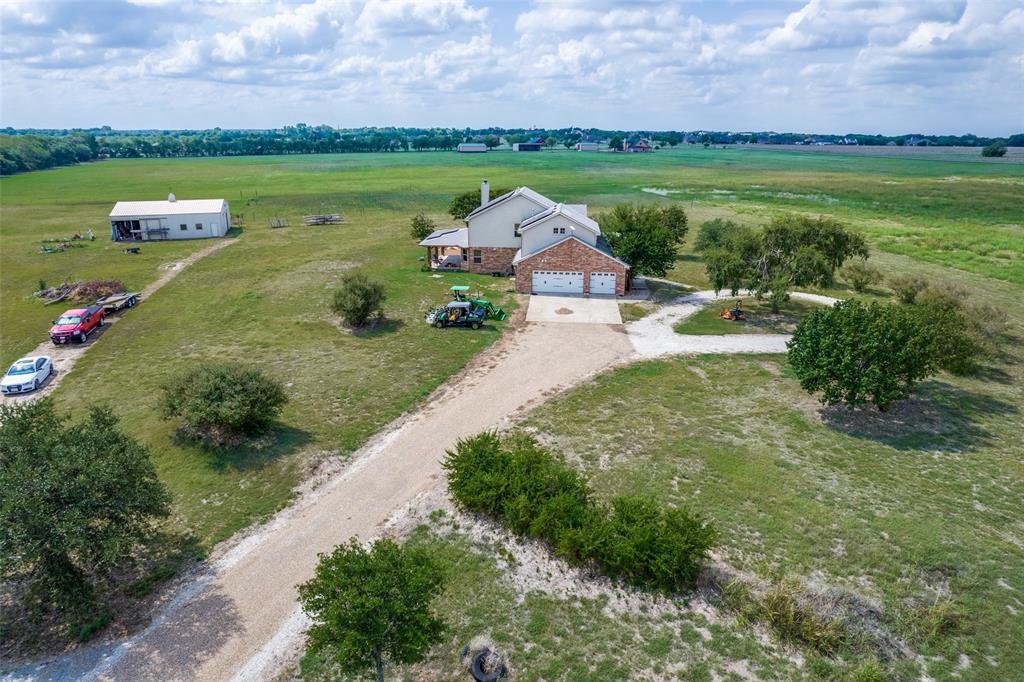 26 plus acre property with 5 bedroom house, 3 baths and an attached 3 car garage.   Just 10 min from shopping, restaurants, golfing and schools. Property is Ag Exempt  3 stall barn with tack room, water and electricity.   Enjoy utility savings with recently installed solar system.  Great   views with large front and back porches.
