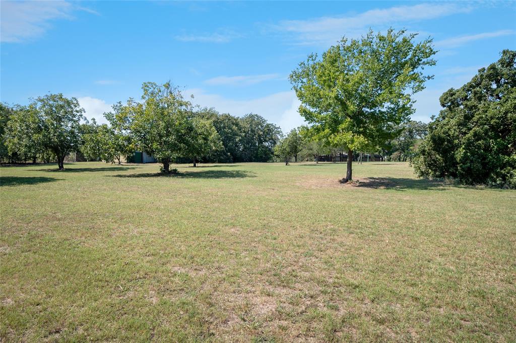 The Ultimate Canvas: 3+ Acres of Rare Southlake Serenity at the end of the Lane.  BRING YOUR OWN BUILDER.
Rarely does an opportunity of this scale emerge in Southlake. Escape to your own private oasis without sacrificing the convenience of Southlake living. Nestled at the end of a private, quiet cul-de-sac, this sprawling 3-acre property offers the perfect canvas for your custom-built masterpiece. Neighboring  multi-million dollar estates.  The land features a breathtaking blend of mature trees and lush pasture areas, complete with a dedicated well for irrigation.
Whether you choose to live in the stylish, 4-bedroom Mid-Century Modern rancher or design the ultimate equestrian estate, the possibilities are limitless. Horses are welcome, the views are unparalleled, and the privacy is absolute. City of Southlake with open enrollment to Carroll ISD.