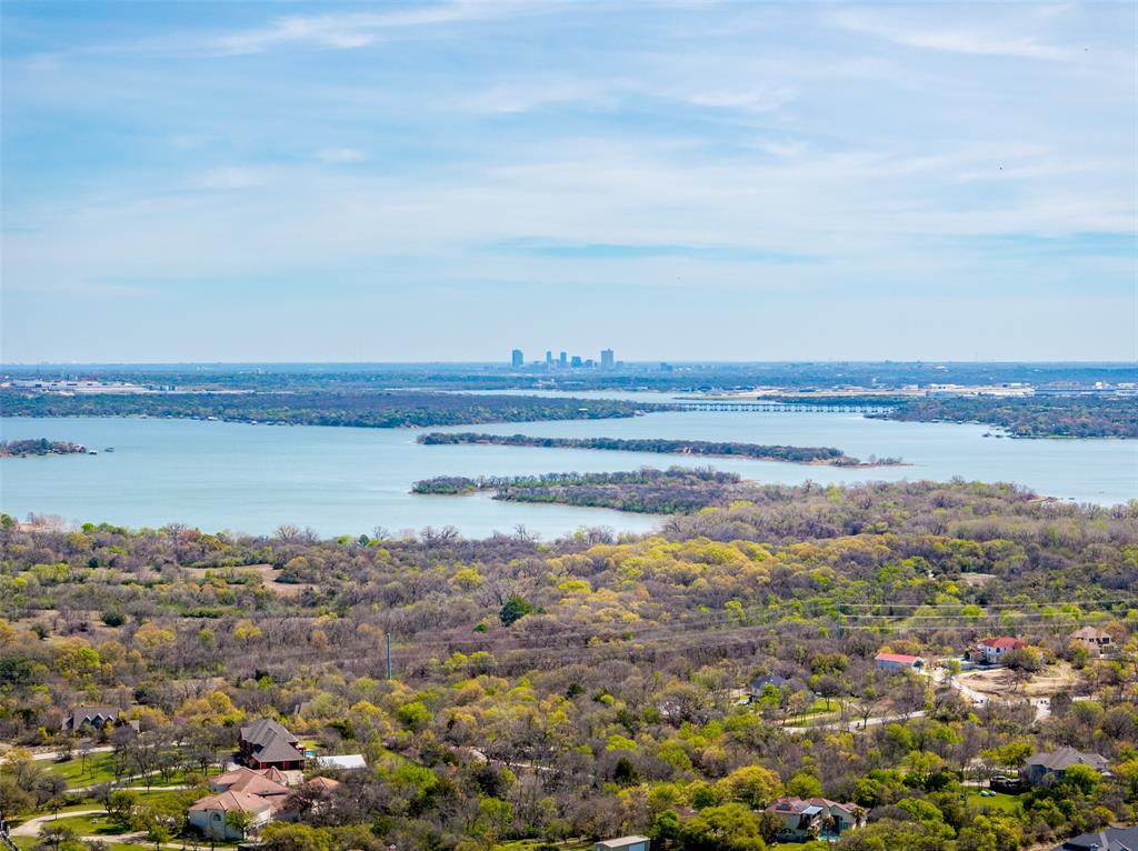 Just West of Fort Worth you can discover he perfect canvas for your dream home. Nestled on a stunning 1.3 acre homesite, this property is a highly desired lot in Estancia. Surrounded by beautifully crafter custom homes, this spacious lot offers the ideal blend of privacy, luxury and overwhelming views. While being just a short drive from all the city conveniences, you will experience peaceful scenery and wide open skies. This property provides the spaces and setting to bring your vision to life. Located in a well-maintained neighborhood with a light HOA, you will enjoy the benefits of a community standard while still having the freedom to create a home that truly reflects your own taste and style. This is more than just land. This is an opportunity to build a life with the feel of classy, country living with city amenities. Please contact the listing agent to have access to the custom builder of your dreams!