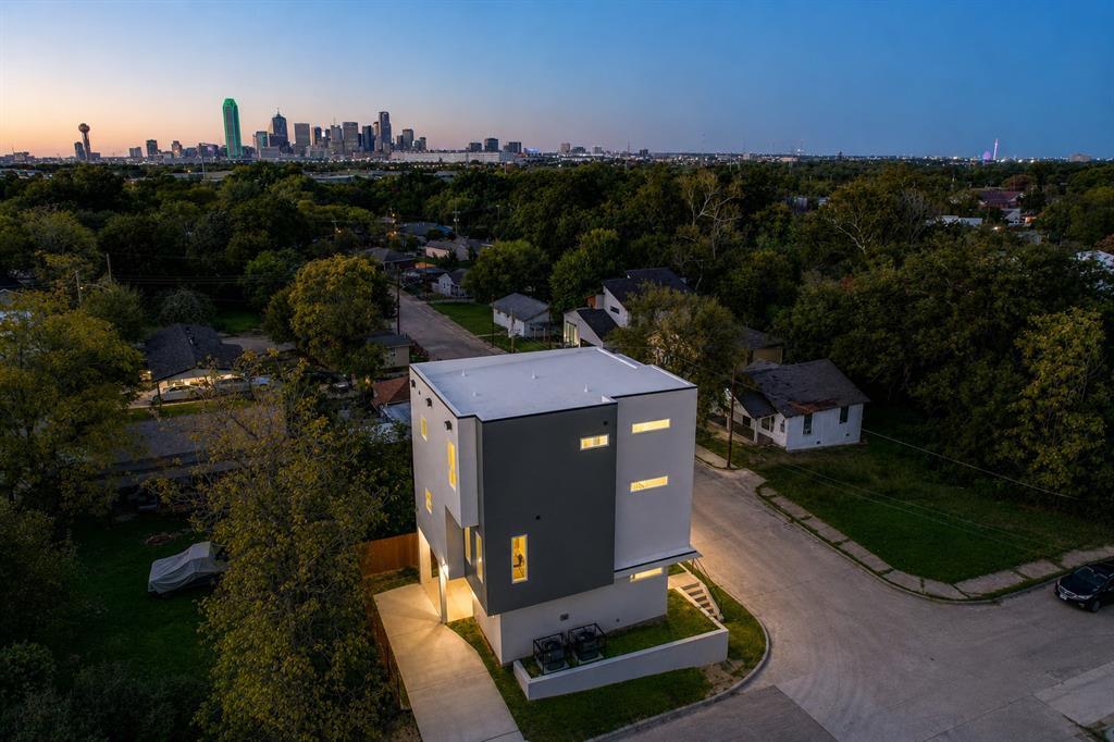 Welcome to 521 Faulk St — a modern Dallas retreat designed for flexibility, lifestyle, and exceptional investment potential. Whether you’re searching for a high-performing short-term rental, a stylish primary residence, or the perfect multi-generational living setup, this property offers the ideal blend of function and city living.

Inside, you’ll find updated designer accent walls, contemporary finishes, and an open-concept layout that creates a warm yet elevated atmosphere throughout the home. The home features both a full kitchen and a stylish kitchenette café bar area, creating the perfect setup for entertaining, hosting guests, multi-generational living, or maximizing rental flexibility. The spa-inspired shower panel system delivers a luxury hotel-style experience, while the stunning downtown Dallas skyline views provide an unforgettable backdrop both day and night.

Home qualifies for $5000 Chase Home Buyer Grant
The versatile floorplan is ideal for multi-generational living, offering privacy and separation across levels — perfect for extended family, guests, roommates, or buyers looking to combine personal living with income-producing opportunities.

Located just minutes from Downtown Dallas, Bishop Arts District, Trinity Groves, and some of the city’s best dining, entertainment, and nightlife, 521 Faulk places you near everything Dallas has to offer. The home is also conveniently located near the newly opened Halperin Park over I-35E, one of Dallas’ exciting new urban green spaces designed to connect communities and enhance walkability throughout the area. Future Phase II plans are expected to extend the park corridor toward Marsalis Avenue, adding even more value and connectivity to the surrounding neighborhood.

Whether you’re entertaining guests, enjoying the skyline views, or leveraging the property’s strong investment appeal, 521 Faulk St presents a rare opportunity in one of Dallas’ rapidly growing and evolving areas.
Agent owner property