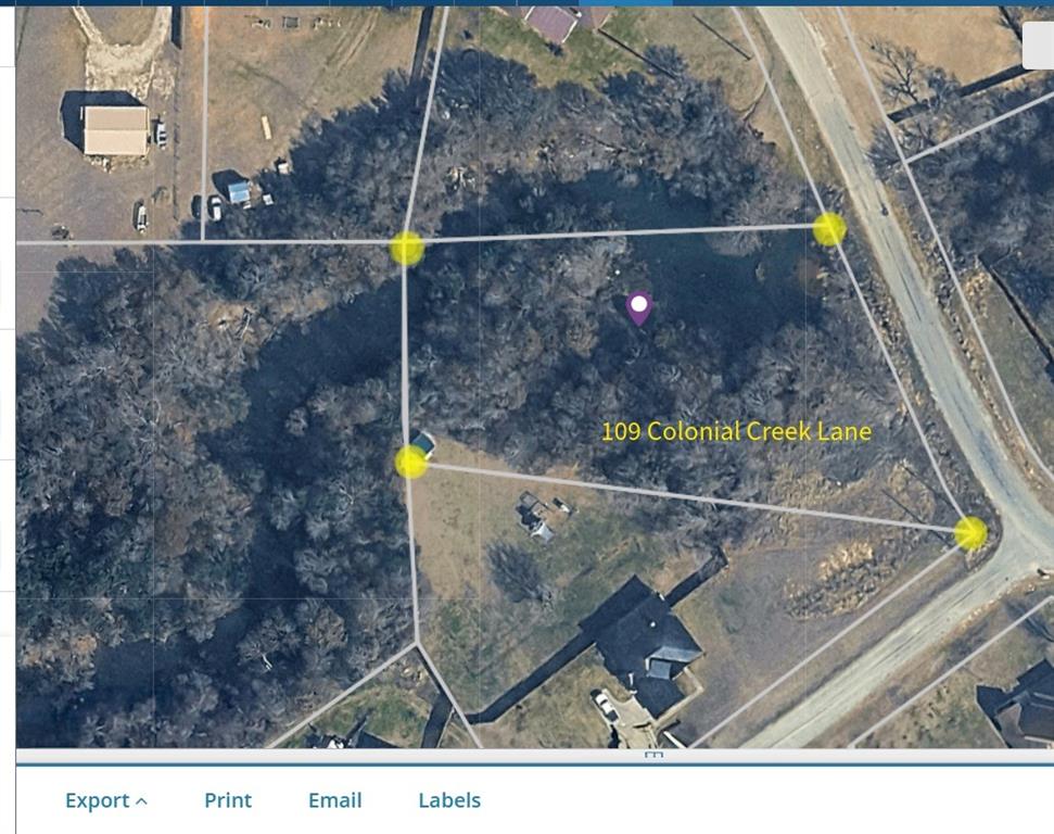 1.26-acre hilltop lot in Parker County, Weatherford, TX, just off Colonial Creek Lane. Elevated building site with views of a shared pond that extends onto the property. Natural topography supports a walkout or view-oriented home design. Embankment could be selectively cleared for water views from living areas or back porch. Gentle incline near road access point.