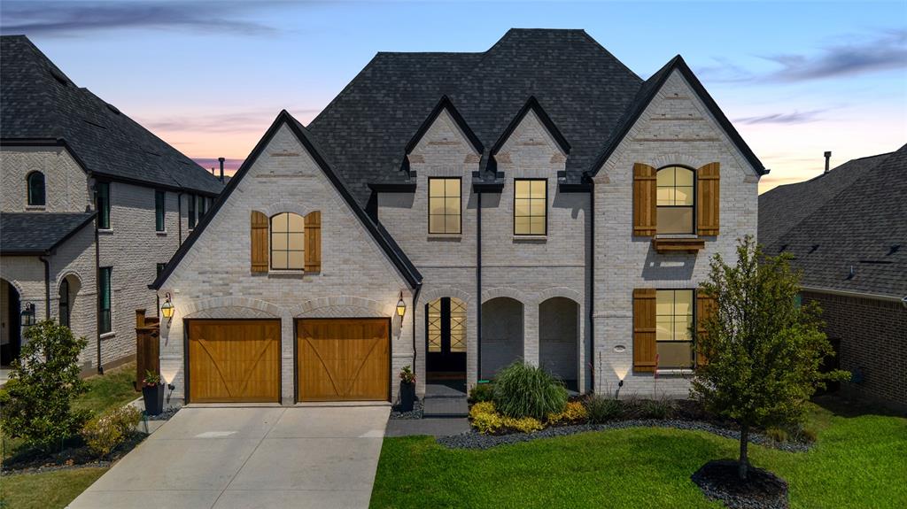 Prosper ISD, 4,358 sq ft, and priced under $1M. This Highland Homes 224 plan offers 5 bedrooms, 5.5 baths, a 3-car tandem garage, and a rare main-level layout with the primary suite, secondary ensuite bedroom, private office, media room, formal dining, and open living-kitchen space all downstairs. Designed as a move-in ready alternative to new construction, the home features wood flooring throughout, dolomite countertops, ceiling-height kitchen cabinetry, extended island seating, designer tile selections, full-height tile showers, upgraded lighting, remote-controlled window shades with blackout shades in bedrooms, insulated interior walls, Ethernet pre-wiring, and a second-floor wireless access point. Upstairs includes three additional bedrooms and a large game room with built-in storage. Outdoor features include a covered patio with pavers, fenced yard, front gas lanterns, roofline outlets for holiday lighting, and added side-yard concrete for trash storage. Schools include Sam Johnson Elementary, Lorene Rogers Middle, and Walnut Grove High. Residents enjoy resort-style amenities including clubhouse, pools, fitness center, sports courts, trails, parks, and a stocked lake.