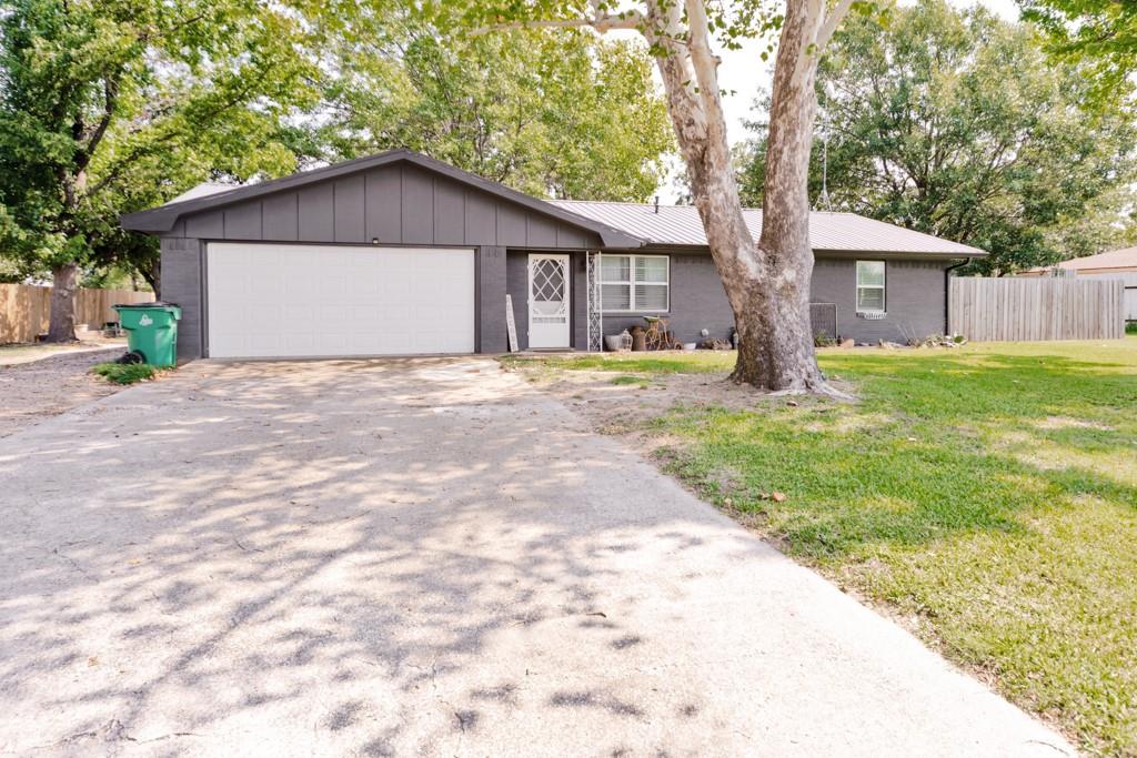 Perfectly Charming Country Retreat- Nestled outside the hustle and bustle, this perfectly charming 3-2 home that is truly a countryside gem. Set on a generous lot, with lush green lot shaded by mature trees, the property feels like serene escape while still being conveniently located close to town. Inside is a completely remodeled home that is ready to step into without any work. Step outside, and the magic continues. A picture-perfect  outdoor kitchen in the recently remodeled she shed with an attached patio back makes for an idyllic spot to sip a drink after sunset and soak in the quiet beauty. The three bay wired shop makes for many possibilities. The pergola is made for gathering whether it's a Sunday brunch or an evening under the stars with friends. This home isn't just a place to feel. Full of personality, warmth and soul it's the kind of property that simply makes you smile.