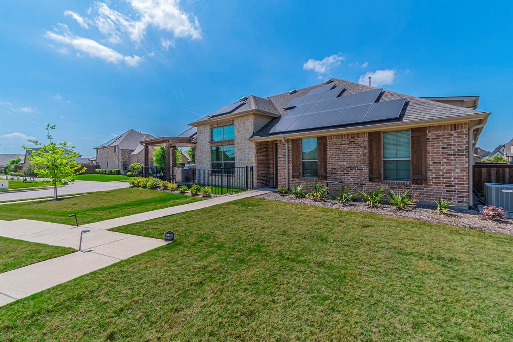 BIG price adjustment!! Now listed at $500,000!
Come experience this amazing property today. Don't miss this opportunity.

Looking for a luxury villa in Prosper with owned solar and an outdoor kitchen? This exceptional 3-bedroom, 2-bathroom Geneva plan Villa by Grenadier Homes in Windsong Ranch features fully owned solar panels and a professional-grade outdoor kitchen with a built-in heater and gas grill. Over $70,000 in upgrades!

This rare end-unit position offers 1,702 sq ft of single-story living with vaulted ceilings and unmatched natural light. The gourmet kitchen boasts quartz countertops, dark cabinetry, and custom storage upgrades. The primary suite features a spa-like double vanity and modern finishes, while two additional bedrooms offer flexibility for a home office or guests.

Windsong Ranch Amenities: Residents enjoy the 5-acre Crystal Lagoon with white-sand beaches, resort pools, fitness center, and over 30 miles of trails. This lock-and-leave home includes front yard maintenance in the HOA and is located within walking distance to Windsong Ranch Elementary and the Commons Café. Financial Value: Solar panels are fully owned, providing significant utility savings and potential Texas tax benefits. The quarterly $579 HOA fee includes full exterior structure, roof, and yard maintenance. Blending premium privacy with resort-style living in top-rated Prosper ISD.