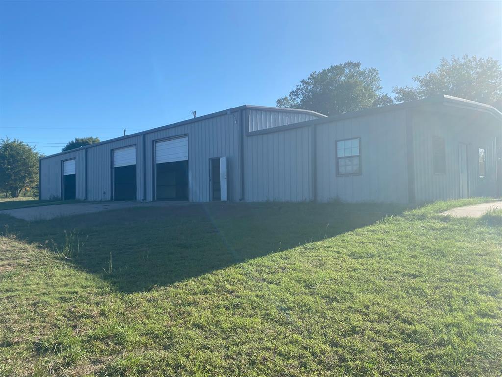 Great opportunity for multiple business types to have garage, warehouse, storage yard and office in a convenient location.  This 3000 square foot metal shop has 3, 12 foot roll up door doors and a 600 square foot attached office with restrooms.  It also includes approximately 2 acres of fenced and gated yard for storage and covered RV parking. On septic and well.  Electricity, general maintenance, landscaping and any build out is tenant responsibility.