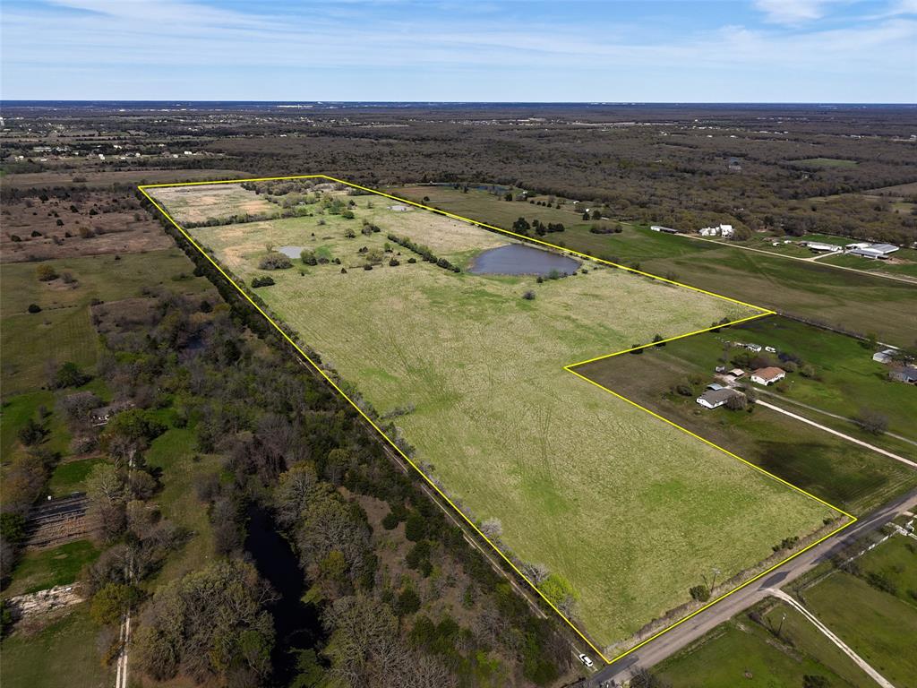 89.954 ACRES ON CR 2546 - PRIME LOCATION THIS IS YOUR OPPORTUNITY FOR  DEVELOPMENT, INVESTMENT, OR YOUR OWN PERSONAL RANCH. A LOT OF FLEXIBILITY. THE PROPERTY IS IN  AG USE AT THE PRESENT WITH CATTLE. 5 PONDS, SCATTERED TREES, CROSS FENCED, AN OLDER BARN, AND POLE BARN. A PEACEFUL SITTING. A PLUS WITHIN A FEW MINUTES OF I-30. LOCATED IN FAST GROWING HUNT COUNTY.