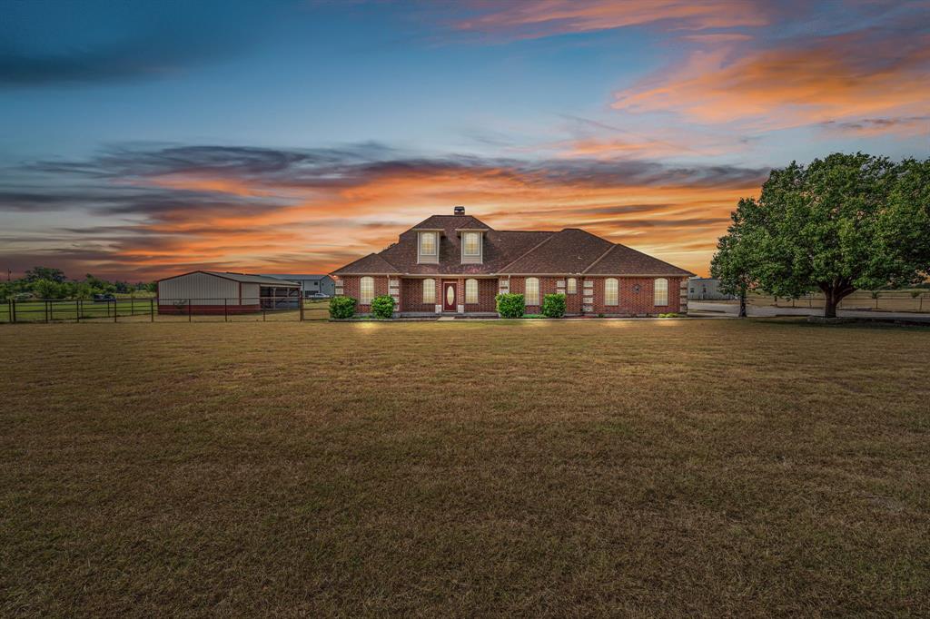 Charming 4-bedroom, 2-bath home on 2.5 acres with endless possibilities! As you walk in, you're greeted by a spacious open living area, complete with a cozy wood-burning fireplace—perfect for those chilly evenings. The inviting atmosphere flows seamlessly into the kitchen, where you'll find plenty of space to create delicious meals and take advantage of the generous pantry for extra storage. Enjoy views of the backyard from the kitchen and living area! Total house sqft is 2939
Retreat to the master bedroom, which features an elegant vaulted ceiling that adds character and a sense of spaciousness. The master bath offers a dual vanity, separate shower, and a soaking tub—ideal for relaxing after a long day.
 Upstairs, you’ll find an expansive upstairs bonus room that could serve as a private 5th bedroom, office, or game room, along with a walk-in attic featuring a fully decked floor for abundant storage.  Home is in unincorporated and unrestricted area!

Outdoors is where this property truly shines—ideal for hobbyists, car enthusiasts, or anyone who needs space. The impressive 40x60 insulated and wired shop is a dream setup including a full bathroom with shower, complemented by an additional large storage building at the back of the property. Horse lovers will appreciate the well-designed stalls and tack room, making it easy to bring your animals home.

The covered back patio is perfect for entertaining or peacefully watching sunsets. Use the designated pad ready for an above-ground pool to complete your backyard retreat. Conveniently located close to town and shopping—with a new Tom Thumb coming soon—you’ll enjoy both privacy and accessibility.