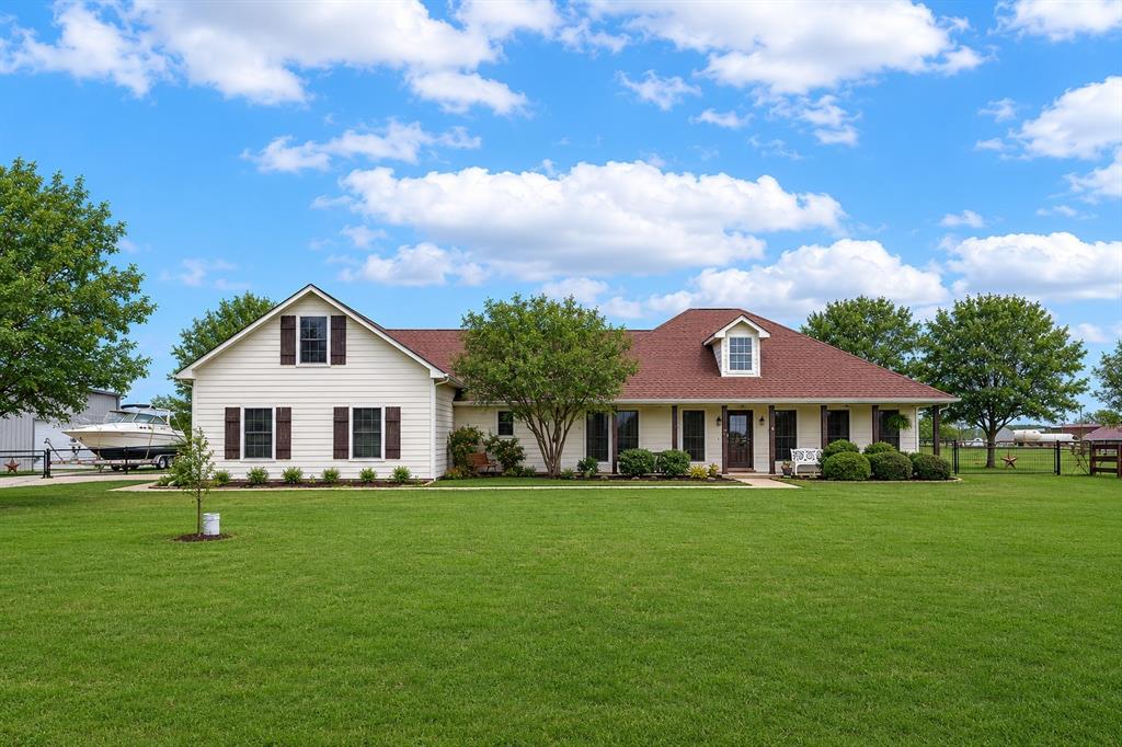 HIGHLY MOTIVATED SELLERS -Priced to sell fast-Way below appraised value-Beautifully maintained 3-bedroom, 2.5-bath home with 2,536 sq ft on 3  acres in desirable Highland Hills Estates in Decatur. Situated on land originally subdivided into three 1 acre lots, the existing fencing combines all 3 acres, creating one spacious homesite and making this one of the few properties in the neighborhood with more than one acre.Stunning view from the back yard. Hardwood flooring flows through the main living areas with plantation shutters throughout and fresh interior and exterior paint in 2025. The home features a dedicated office off the primary suite and an upstairs flex space with a half bath, ideal for a game room, guest space, or media room. Major updates include new HVAC and water heater in 2023. Safety features include two storm shelters, including a 12-person in-ground fiberglass shelter. The property also offers a 36 ft by 36 ft shop with 2, 10 Ft Rolling doors, perfect for storage, hobbies, or workspace. A rare opportunity to enjoy space, comfort, and peaceful North Texas living. ** $2,000 seller concessions for carpet or buyer needs**You must see in person. Pictures do not do this large home justice!! **With Preferred lender free rate buy down**