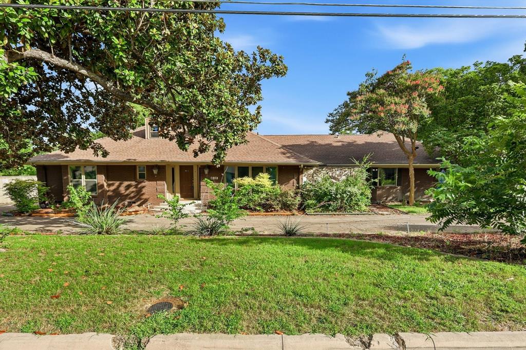 Nestled on a beautifully landscaped lot in an established Dallas neighborhood, this unique waterfront property offers endless potential and picturesque views. Situated on a large pond with a private dock, you'll enjoy a peaceful setting rarely found in the city. The home features 4 bedrooms, 3 bathrooms, hardwood flooring throughout much of the home, expansive windows that fill the space with natural light, and charming bay windows that showcase the scenic surroundings.

Outdoor living is a standout feature, with a sparkling pool, spacious balcony overlooking the water, and mature trees that enhance the beauty of the property. Conveniently located near I-35, shopping, dining, and everyday amenities, this property combines tranquility with accessibility.

Ready for a new owner's vision and updates, this home offers a rare opportunity to renovate and create something truly special. With its exceptional lot, water views, private dock, pool, and timeless character, this property presents the perfect blend of location, space, and potential.
