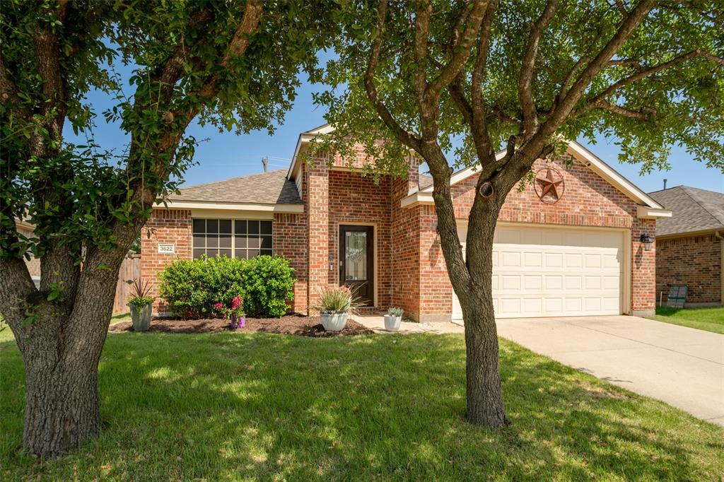 Meticulously maintained move-in ready pet and smoke free home.
Nestled beneath a canopy of mature shade trees in the sought-after community of Melissa, Texas, this exquisitely maintained all-brick residence delivers a rare combination of warmth, elegance, and thoughtfully curated design. From the moment you arrive, the home's striking curb appeal, lush landscaping, designer container gardens, and a classic brick facade adorned with a traditional Texas star sets the tone.
The home unfolds into an expansive open-concept floor plan where soaring vaulted ceilings, premium flooring, and an abundance of natural light define every space. Just off the entry foyer, a versatile front room with elegant architectural detailing serves beautifully as a private home office or study — currently utilized as an additional bedroom, offering the flexibility today's buyers demand. At the heart of the home, the dramatic great room commands attention with a breathtaking floor-to-ceiling stacked-stone fireplace, a masterwork of hand-laid grey ledgestone that serves as the undisputed architectural centerpiece of the home. The gourmet chef's kitchen impresses with quartz countertops, a full-height subway tile backsplash, shaker-style grey cabinetry, professional gas range, and a sweeping peninsula that opens seamlessly to the living area, perfect for both casual mornings and refined entertaining.
The primary suite is a true owner's retreat featuring an oversized walk-in wardrobe, a spa-inspired ensuite complete with a dual quartz vanity, matte black fixtures, deep soaking tub, and glass-enclosed walk-in shower. Secondary bedrooms are generously sized and full of personality, including a mid-century modern inspired bonus room that functions equally well as a media lounge or formal dining setting.
Outside, enjoy an East facing shaded backyard to escape the Texas heat.
