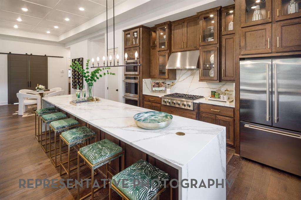 New Treviso plan by Highland Homes. Volume ceilings and open design for easy living. Dream kitchen has 14' long island, an abundance of custom cabinets, 6 burner gas cooktop, dbl ovens. Great room has hutch w wine fridge in dining area, fireplace and beam ceilings in family room. Study w wood floors & built-in bookshelves overlooks backyard. Primary has sitting area w amazing natural light, wood floors, a spa bath w large tiled shower, freestanding tub and closet with custom shelving. All en suite bedrooms w walk-in closets. Game room for entertaining fun, Utility room has sink & room for 2nd fridge. Outdoor living w gas line and pool bath. Back yard has room for pool. Upgrades galore in this gorgeous home. Won't last!