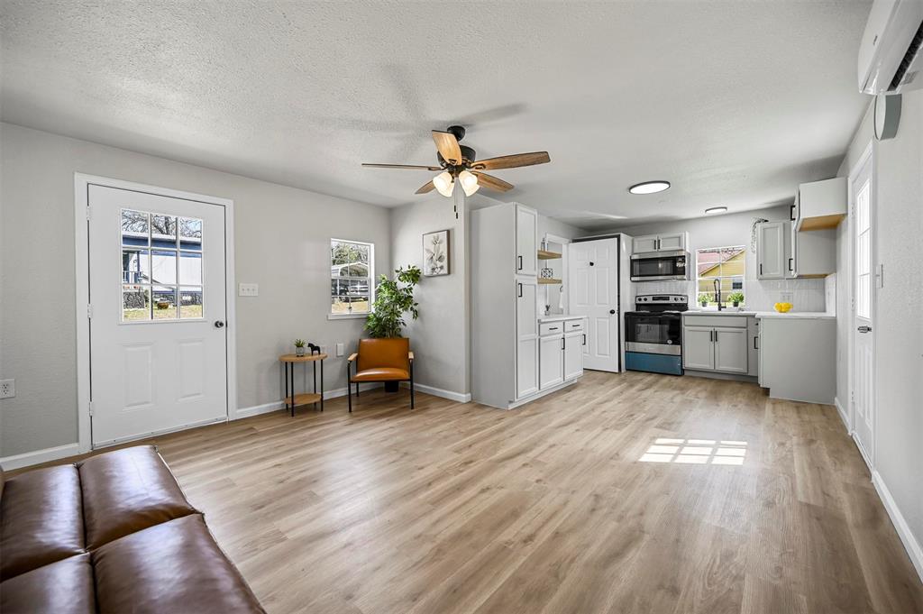 Turn Key Tiny Home Priced Below Value! Tucked beneath the trees in Bluewater Oaks, this charming home brings all the warmth and simplicity of a cozy cabin with the comfort of thoughtful modern updates. With just over 900 square feet, this 1-bedroom, 2-bath retreat feels inviting and surprisingly spacious, offering the perfect blend of snug living and practical design. Step inside to an open, welcoming layout where the kitchen and living spaces flow together with ease. Soft natural light, fresh finishes, and easy-care flooring create a calm, comfortable atmosphere. The primary suite feels like its own hideaway with an ensuite bath and walk-in closet, while the rare second full bathroom makes hosting or daily routines wonderfully convenient. Updated cabinetry, countertops, stainless steel appliances, and new touches throughout bring a fresh feel while keeping the charm intact. A sturdy metal roof and central HVAC ensure year-round comfort, whether this becomes your full-time nest or your peaceful weekend escape. Bluewater Oaks offers the kind of community amenities that make simple living feel special — a shared dock, boat ramp, playground, basketball court, and well-kept common areas. With city water and sewer, co-op electric, and HOA grounds maintenance included, everything stays easy and stress-free. If you’re dreaming of a cozy place to unwind, downsize, or enjoy the tiny-home lifestyle with a little more room to breathe, this home is ready to welcome you.