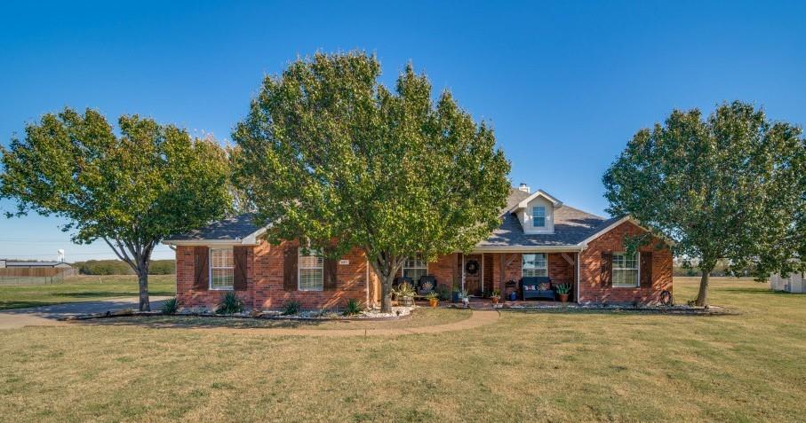 Priced reduced.... Where else can you find a modern traditional home with an in-ground pool on acreage?  Look no further!  This amazing updated open concept home features 4 large split bedrooms for privacy, 3 full baths, one room could be used as a mother in law suite, den could be office or game room, large updated kitchen with ample cabinets, quartz, backsplash, appliances, island with real butcher block and electric, and breakfast bar which opens to large living area with corner floor to ceiling brick fireplace.  Enjoy year round comfort with a new HVAC system in 2024, hardwood flooring throughout, and drought tolerant landscaping for easy maintenance.  The backyard is your private retreat featuring an oversized in-ground pool, covered patio, sided wood fence, loads of playing areas, and open space behind for that true country feeling. Access to property can be obtained off county road.  Workshop style buildings acceptable. 3 car garage, extra parking space, keyless entry, and a vivant camera security system included making this home the total package.  Come fast and make this home yours!