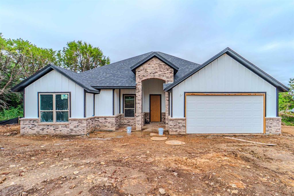 NEW CONSTRUCTION!! Located in a gated lake community. 4 Bedrooms, 2 bath home. This Gem offers modern features, Design, space, and layout. All custom tiled baths, and backsplashes. Custom-made kitchen cabinets and bathroom vanities. Custom-made brick chimney. Double vanity in the master bathroom. Beautiful Quartz countertops throughout the kitchen and bathrooms. This home has a nice and unique open floor concept with a lot of natural lighting, so you can go wild decorating spaces! Home is sitting on a big lot. This home is equipped with energy-saving insulation, with highly efficient HVAC, and WH, perfect for energy saving! Come see this Gem today, while it lasts!