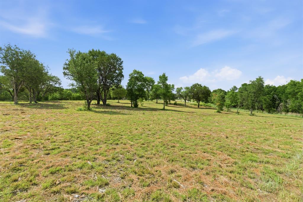 Build Your Dream Home in Eagles Bluff! Nestled on a beautiful 2.185-acre cul-de-sac lot in the highly sought-after Eagles Bluff community, this exceptional property offers the perfect blend of privacy, natural beauty, and convenience. Cleared and ready for your custom home, the lot features stunning mature trees and a picturesque setting that provides the ideal backdrop for country living. Enjoy the peace and tranquility of acreage living while being located in one of the area's most desirable neighborhoods and within the highly acclaimed Brock ISD. With ample space to design your dream home, shop, pool, or outdoor entertaining area, the possibilities are endless. Rarely does an opportunity like this come available—bring your builder and start turning your vision into reality!