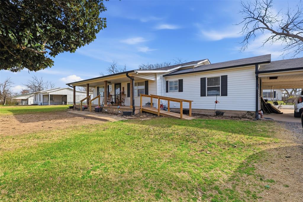 Beautifully renovated 3 bedroom, 2 bath home with stylish finishes, spacious room sizes, new kitchen cabinets and quartz countertops, new appliances, wood burning stove, covered patio, covered carport, storage building and old barn providing ample space for hobbies, equipment or additional storage. ALL on 2 acres with NO restrictions just minutes from downtown Winnsboro. This wonderful property offers endless possibilities. A unique bonus feature is the salon space at the front of the home, complete with a ramp leading to the front door offering excellent accessibility and potential for a home-based business or studio or office or it can easily be converted back to a bedroom. With acreage, updates throughout and a prime location close to town, this property is a real charmer for those wanting to live outside the city limits. Schedule your showing today and explore all that this versatile property has to offer.