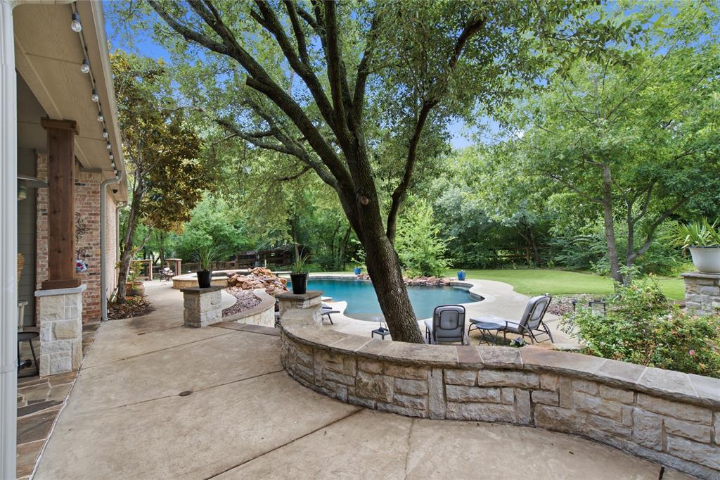 Back on the market through no fault of the home, offering buyers a second opportunity to own this exceptional property. Previous Buyers unable to obtain financing.

Experience refined country living without Argyle city taxes. Tucked into the charming Steeplechase pocket neighborhood, this exceptional corner-lot property offers privacy, space, and elevated outdoor living.

The backyard features a heated pool and spa, a lit putting green, outdoor living and dining spaces, an outdoor kitchen with Bull appliances, raised garden beds, a chicken coop, and plenty of room to play or unwind.

Inside, a dramatic wall of windows overlooks the backyard and fills the home with natural light. The front library offers a cozy retreat and can easily function as a formal dining room. The gourmet kitchen opens seamlessly to the spacious living and dining areas, creating an ideal layout for gathering with family and friends. A private downstairs bedroom provides the perfect space for guests.

The primary suite is a true retreat, featuring a spa-inspired bath with a freestanding soaking tub, illuminated mirrors, and a generous walk-in closet designed with both beauty and functionality in mind.

Upstairs, you'll find a large secondary living area, four additional bedrooms with spacious closets, and a Jack-and-Jill bath designed for convenience. One bedroom with double doors is currently being used as an office, offering flexibility for today's lifestyle.

The three-car garage provides abundant storage and parking, with the third bay enhanced by blown-in insulation and its own HVAC unit, deal for a gym, workshop, or hobby space. A circular drive and oversized driveway add both convenience and impressive curb appeal.

Combining luxury, functionality, and an incredible outdoor lifestyle, this one-of-a-kind property truly offers it all.
