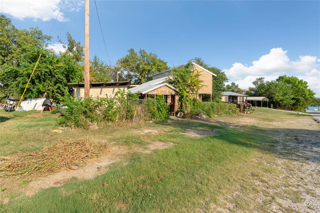 Affordable Waterfront Opportunity at Moss Lake. Discover the potential in this unique one and half story 3-bedroom home with waterfront access on highly sought after Moss Lake. With a few finishing touches, this property could shine as a weekend retreat or full-time home.6 mini-split units for room to room control & highly energy efficient. Smart Siding. Spray foam insulation in all walls. Features laminate flooring, new hot water heater and many upgrades. Waterfront access. Put your dock in at your property, and you're ready for lake enjoyment.  Also, less than a minute from the North boat ramp for easy lake access. Whether you're looking to invest, relax, or entertain, this home offers a rate blend of value, location, and lifestyle. Moss Lake is known for its clear waters, friendly community, and peaceful setting. Call today!