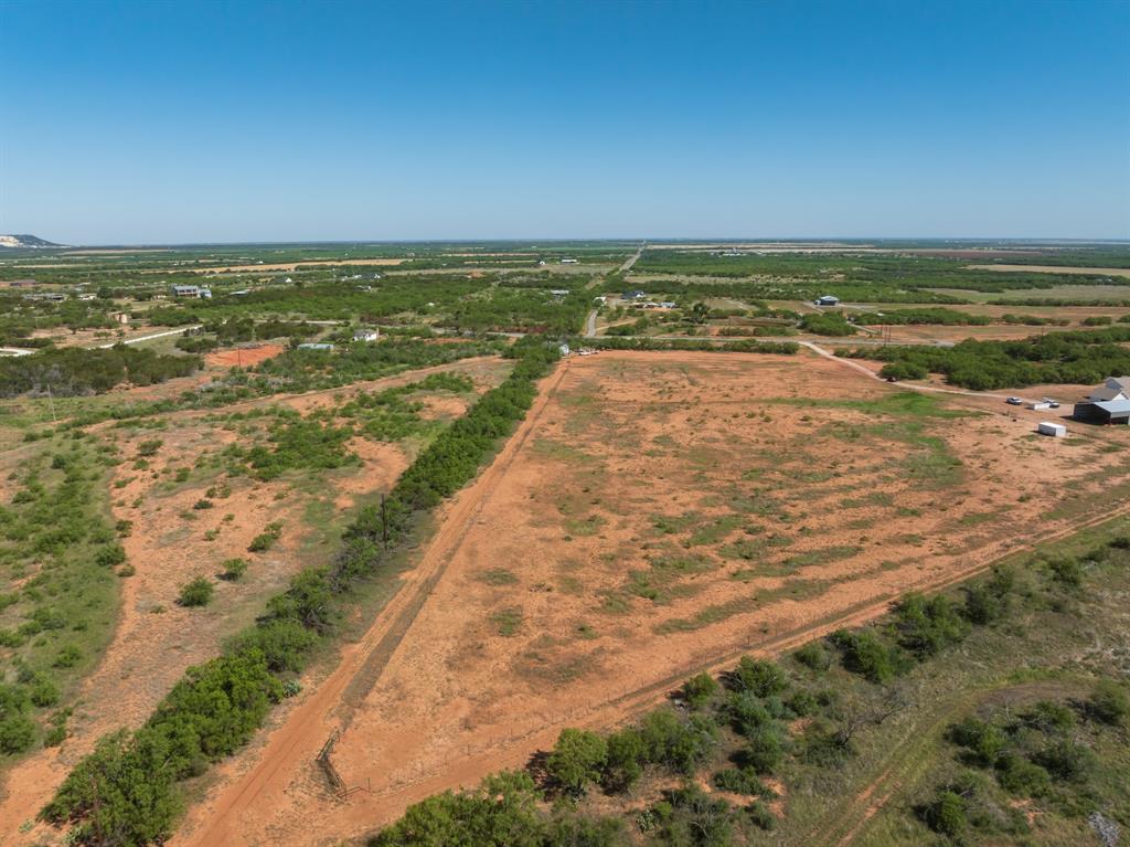Come build your dream home or barndominium just 10 minutes from town. This 11.853 acre lot is located on a dead end county road with beautiful views and sunsets in Wylie school district. Lot 19 has the option to choose who you want to use for electricity. You can use Taylor Electric or AEP or both. There is a temporary pole ran with underground wires set for a barn or shop only. You will need to get with Taylor Electric to ask if this can be used for a residence. The meter just needs to be set in that pole. AEP is on the county road. View Caps Water is available. There is a water meter box already set and ready for a meter to be purchased. There will need to be a culvert and driveway placed. Lot 19 has a 4 acre goat fence pasture. This pasture needs to have a property line fence put in to separate lot 18 & 19. Please do not walk the property with out an agent. Buyer and buyers agent to verify any and all information. Please see the plat and the flagged property lines. The white animal lean will come with the lot. The shed is not included.