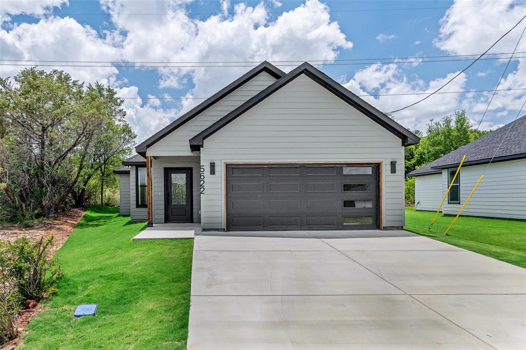 Welcome home to this beautifully crafted new construction property in Granbury, TX, where modern design meets everyday comfort. Boasting 3 bedrooms and 2 bathrooms, this home stands out with its eye-catching dark exterior and thoughtfully selected finishes that create a warm yet contemporary atmosphere. Inside, you'll find an open-concept layout designed to maximize both space and functionality. The spacious living area flows seamlessly into the kitchen and dining space, making it easy to entertain guests or enjoy time with family. The kitchen is sure to impress with a large center island, quartz countertops, a pantry, and a full suite of stainless steel appliances including an electric range, microwave, and dishwasher. The private primary suite offers a peaceful escape at the end of the day. The ensuite bathroom features dual vanities with quartz countertops and a stylish glass-enclosed shower. A spacious walk-in closet provides plenty of room for storage and organization. Two additional bedrooms offer flexibility for family, guests, or a home office, while the secondary bathroom continues the home's upscale design with matching quartz countertops. Additional conveniences include a dedicated laundry room with full-size washer and dryer hookups, a spacious 2-car garage, and a covered back patio that's perfect for outdoor dining, relaxing, or enjoying the Texas sunset. Located within the desirable Canyon Creek community, residents enjoy access to a guarded security gate, community clubhouse, swimming pool, fishing pier, tennis courts, and multiple boat ramps. With direct access to Lake Granbury and just a short drive from Granbury's historic downtown square, you'll have endless opportunities for recreation, dining, shopping, and entertainment. Don't miss your chance to own this exceptional new home in one of Granbury's most sought-after lake communities. Schedule your private tour today and see everything this beautiful property has to offer.