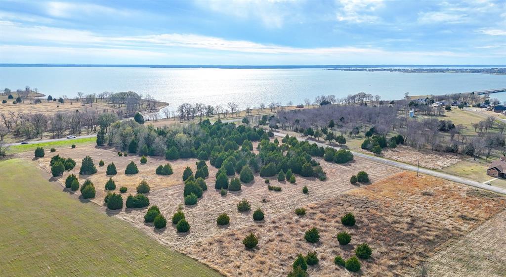 Elegant Lake Living opportunity! This 2.01 acre lot offers an amazing opportunity to build your dream home near the shores of Richland Chambers Reservoir, the third largest lake in Texas ! The property is located inside a gated community with site built homes of 2,000 square feet or more. This lot offers the perfect topography for building along with open spaces with scattered trees for spacious living inside a prestigious community .Owner Financing Available.