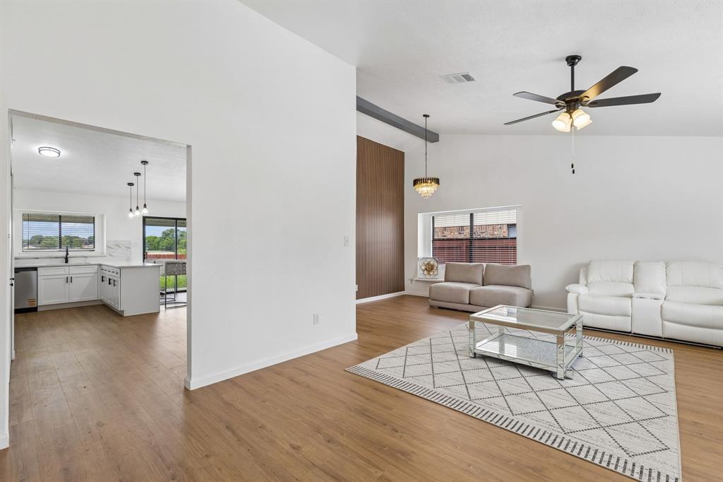 Recently remodeled and move-in ready, this beautifully updated 3-bedroom, 2-bath residence offers 1,796 square feet of stylish living space in an established Central Arlington neighborhood. Built in 1983 and thoughtfully refreshed, this home combines timeless comfort with modern finishes that today's buyers are searching for. Step inside to discover an inviting layout featuring two spacious living areas, two dining spaces, soaring vaulted ceilings, abundant natural light, and an open flow designed for everyday living and effortless entertaining. The remodeled galley kitchen overlooks the breakfast area and family room and showcases updated cabinetry, attractive countertops, quality stainless steel appliances, a stylish backsplash, and ample workspace for meal preparation. Recent improvements include a remodeled kitchen, updated bathrooms, new flooring, a newer roof, and fresh finishes throughout, creating a truly turnkey opportunity. The spacious primary suite offers a beautifully renovated bath with contemporary fixtures and an upgraded shower, while the secondary bath has also been tastefully refreshed. Fresh paint enhances the bright interior, and every update reflects the pride invested in this exceptional property. Outdoors, enjoy a generously sized backyard with room for gardening, recreation, pets, or future outdoor living enhancements. The expansive yard provides flexibility while the covered patio creates an ideal place to unwind or entertain. According to the seller, the freshly remodeled interior, excellent paint, spacious yard, and welcoming neighborhood are among the home's standout qualities. Convenient access to major highways, shopping, restaurants, parks, and everyday conveniences further enhances the appeal. If you are looking for a recently remodeled Arlington home with updated kitchen, updated bathrooms, new flooring, modern finishes, generous living space, and exceptional value, this property deserves a place at the top of your list.