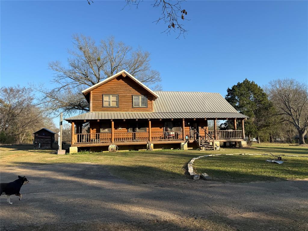 Set on 40 picturesque acres, this exceptional farm offers a rare blend of rustic charm, privacy, and wide-open space. At the heart of the property sits a striking large log cabin, showcasing timeless craftsmanship, warm natural wood interiors, and an inviting lodge-style atmosphere. The home is perfectly positioned to take in sweeping views of the surrounding land, with ample room for relaxing, entertaining, or enjoying peaceful country living.

The acreage provides endless possibilities—ideal for farming, livestock, recreation, or simply enjoying nature. The property includes a horse stable to support equestrian pursuits, along with an unfinished arena already in place and equipped with lighting, offering a head start for training, riding, or events. A covered tractor shed provides practical equipment storage and functionality, and while it will need some repairs, it presents an opportunity to restore and customize to suit your needs. Rolling fields, mature trees, and open pasture create a scenic and functional landscape, where hogs and deer are frequently seen roaming the property, adding to the natural beauty and appeal for outdoor enthusiasts. Whether you envision a working farm, a weekend retreat, or a full-time homestead, this property delivers space, character, and opportunity in abundance.

All information deemed reliable, but it is the buyers responsibility to verify.

For more information go to loopedin.network and search property ID 43.