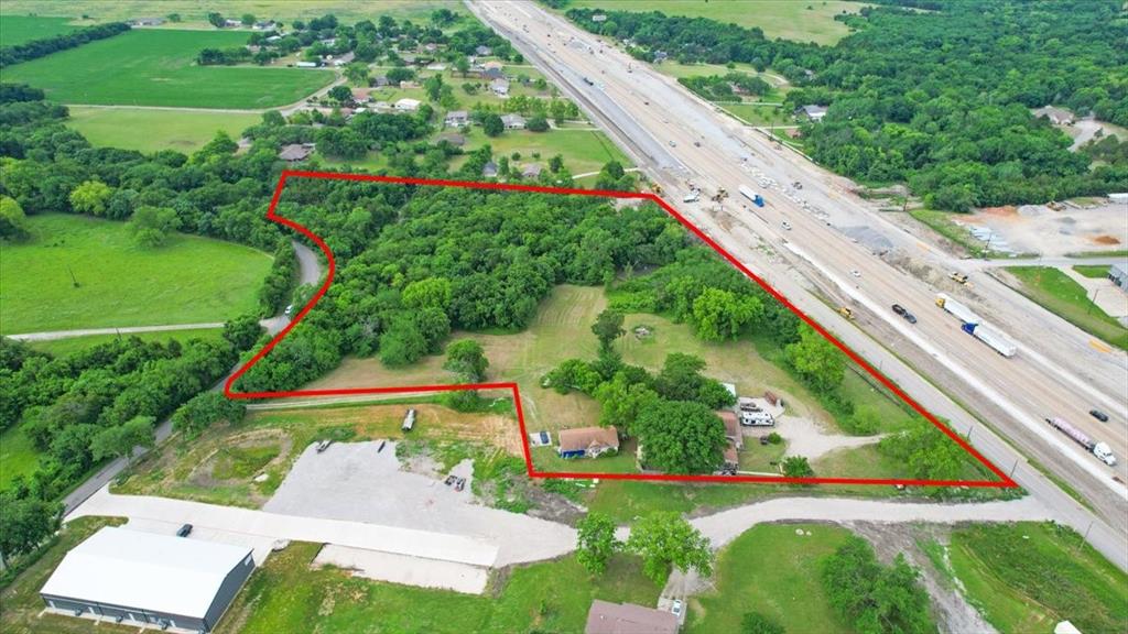 Prime commercial investment opportunity with exceptional visibility and accessibility on highly traveled Hwy 75 in rapidly growing Van Alstyne. Offering valuable road frontage on two sides, this property presents outstanding potential for future commercial development, owner-user investment, or long-term hold in one of North Texas’ expanding growth corridors. The property includes two livable homes currently situated on the land; however, the list price reflects land value only, creating a rare opportunity for investors, developers, or business owners looking to capitalize on location and frontage. Excellent access, strong traffic exposure, and proximity to major thoroughfares make this a strategic site for a variety of commercial uses. Opportunities with this level of visibility and flexibility are becoming increasingly difficult to find in the path of growth.