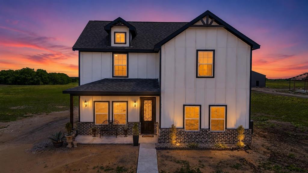$5,000 IN SELLER CREDITS!!!

Modern farmhouse living meets wide-open Texas land on this 11.127-acre AG-exempt property in Ennis. This new construction home stands out with its classic board-and-batten exterior, brick accents, and inviting front porch, all set against peaceful countryside views.

Inside, you’ll find a thoughtfully designed layout with warm modern finishes, a cozy fireplace, and custom built-ins that add both character and functionality to the main living space. Upstairs, a spacious game room provides flexibility for entertaining, a second living area, or a private retreat.

The oversized covered patio is a true highlight, offering the perfect place to relax while overlooking mature trees and open land. The property blends usability and privacy, featuring a scenic creek along the back portion of the acreage. A charming footbridge leads into a wooded, wildlife-rich setting that creates a peaceful escape right at home.

With mostly level terrain, the land is well-suited for horses, livestock, a shop, pool, or future expansion, with the added opportunity to build up to two additional homes.

Ideally located just minutes from Highway 34 and I-45, and a short drive to Lake Bardwell and Historic Downtown Ennis, this property offers the rare combination of privacy, convenience, and long-term potential.