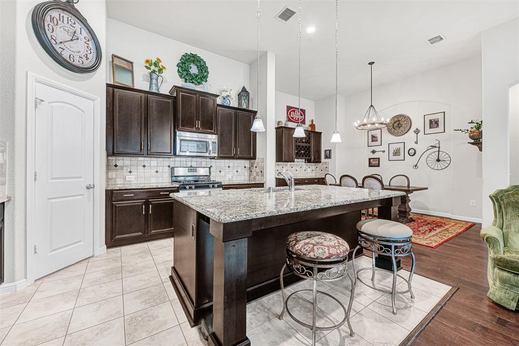 Welcome to this beautifully maintained one-owner home by Plantation Homes, offering the perfect blend of comfort, simplicity, and low-maintenance living in one of Sachse’s most convenient locations. With 3 bedrooms, 2 bathrooms, and a thoughtfully designed single-story layout, this home is ideal for buyers looking to right-size without sacrificing style, functionality, or entertaining space.

Inside, the open-concept design creates an easy, comfortable flow for both everyday living and hosting guests. The spacious living and dining areas are anchored by a custom-built bar, adding character and flexibility whether you envision a coffee station, wine bar, or the perfect space for gathering with friends. The kitchen opens seamlessly to the main living area, creating a warm and connected atmosphere throughout the home.

Step outside to the extended covered patio, designed for relaxing mornings, quiet evenings, and effortless outdoor entertaining. Whether enjoying dinner outside or unwinding at the end of the day, this space offers a private extension of the home’s inviting lifestyle.

This home also offers the peace of mind buyers appreciate with clear pride of ownership  and a new furnace and thermostat that gives you the opportunity to personalize the space to your taste without the expense of major updates.

Beyond the home itself, the location offers exceptional convenience. Just minutes from President George Bush Turnpike, commuting to Richardson, Plano, and Dallas is simple and efficient. Nearby shopping, dining, golf, parks, and walking trails make it easy to enjoy an active, connected lifestyle while still coming home to a quiet neighborhood setting.

Move-in ready, thoughtfully maintained, and perfectly sized for comfortable living, this home offers an exceptional opportunity for buyers seeking ease, convenience, and lasting value.