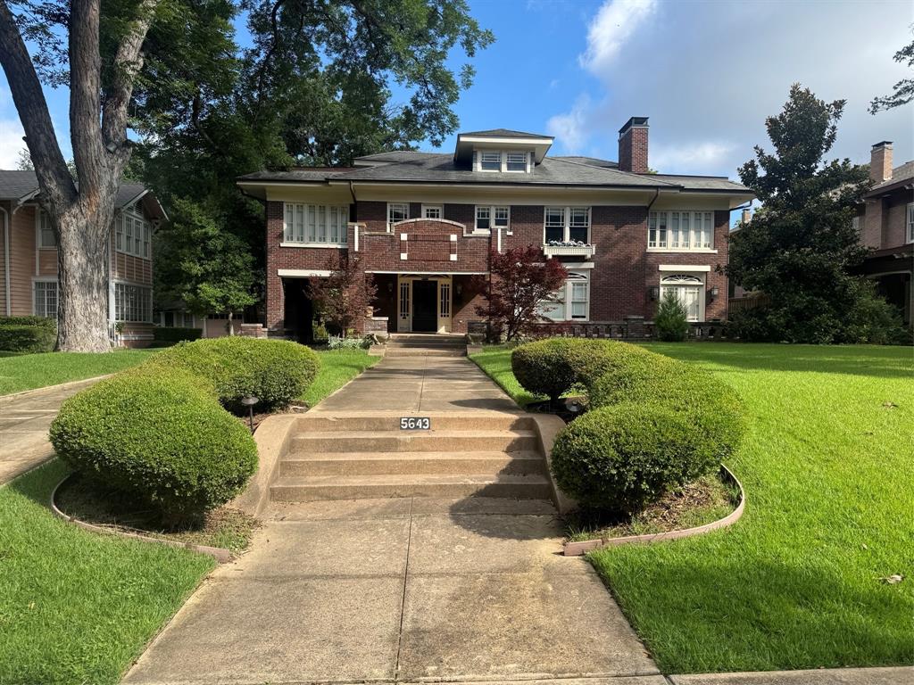 A majestic Prairie Craftsman set prominently on the boulevard in the prestigious Swiss Avenue Historic District, this remarkable residence has been masterfully reimagined to honor its architectural heritage while delivering the ease and sophistication of modern luxury living. Every system has been thoughtfully updated, including fully replaced mechanicals, offering comfort, safety, and peace of mind. Rich in craftsmanship and historic detail, the home showcases five extraordinary Rookwood fireplaces,the largest installation of Rookwood this side of the Mississippi,along with custom built ins, milled moldings, and hardwood floors throughout. The gracious living room is anchored by a Rookwood fireplace flanked by bespoke cabinetry, while the adjoining sunroom, with its own Rookwood fireplace and inlaid floor, opens seamlessly to an expansive front porch made for elegant entertaining and quiet mornings alike. The second level offers four generous bedrooms, three full baths, three fireplaces, and a beautifully appointed laundry room. A stunning 714 sq ft 3rd floor flex space with a half bath provides endless possibilities for a studio, retreat, office or additional bedroom. Designed for everyday living and memorable gatherings, the oversized eat-in kitchen features designer appliances, a commanding island, custom cabinetry, and specialty drawers, flowing effortlessly to a retractable covered outdoor kitchen and living area. The resort-style outdoor setting centers around a fireplace and sparkling pool, creating an inviting private escape. A three-car brick garage with period doors includes an attached area with a full pool bath and flexible space for gardening, a workshop, or additional living. Above, private quarters offer 1,250 square feet with a full bath and kitchen, ideal for guests, extended stays, or refined auxiliary living. The 756 sq basement includes a dog-washing station, and a whole property generator ensures uninterrupted comfort in every season.