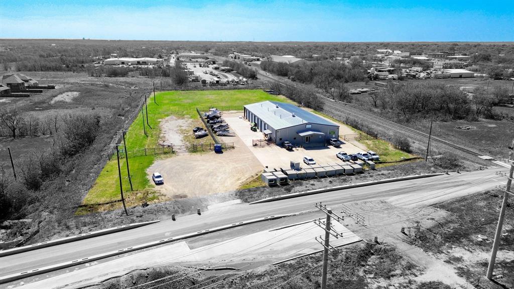 We are pleased to present the opportunity to acquire a 10,575-square-foot flex property in the fast-growing community of Sanger, Texas. The building features a retail-warehouse configuration with a front storefront offering a reception area, private office, kitchenette, and ADA-compliant restroom, connected to a spacious warehouse designed for operational versatility. The warehouse includes a single-bay section with two 14-foot electric grade-level doors, a 3,000-square-foot mezzanine, shop restrooms, and a main area with twelve 12’x14’ manual doors, a smaller rear roll-up door, gas heating units, and dual firewalls. Ceiling heights range from 15 ft. (wall) to 22 ft. (center), with a rear awning and wash bay drainage capability for added functionality. Situated on 3.974 acres (Less than 0.20 acres in floodplain), the fenced site provides ample paved and gravel areas for secure outdoor storage. Zoned Light Industrial, the property is ideal for owner-users in automotive, boat-RV, or equipment sales and service, contracting, or light manufacturing. Located just half a mile from Interstate 35, the site offers convenient access to major transportation routes and nearby retail, making it a strong operational and investment opportunity in the expanding North Texas market.