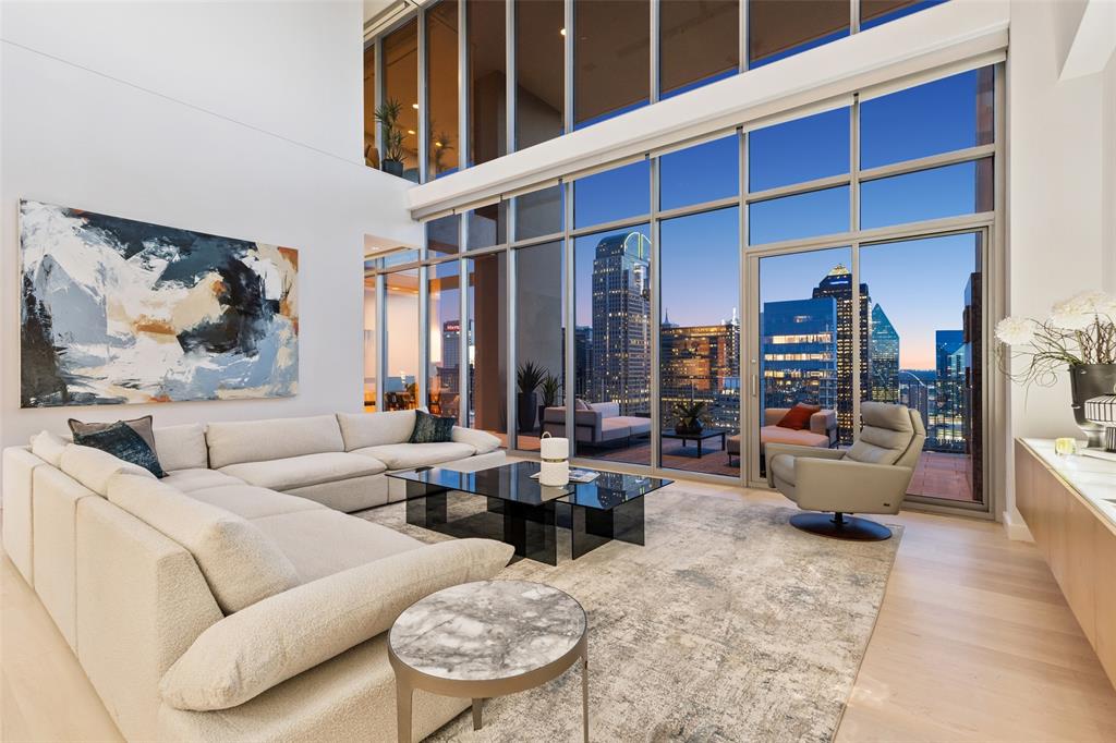 Landmark penthouse at top of One Arts Plaza available for the first time overlooking Downtown, Arts District, Trinity River, Uptown, North Dallas and Fair Park with unobstructed views in three directions. Full service building with valet parking and concierge. Ground level plaza features restaurants including award winning Tei-An for Japanese fusion. Walking distance to museums, symphony center, area restaurants and Klyde Warren Park. Penthouse selected by Cantoni to showcase their furniture and art which is available for separate purchase, or work with their designer to customize the interior to your own taste. Three assigned parking spaces are the best in the building surrounding the residential elevator entrance. Secure storage unit convenient to loading dock by freight elevator. Interior of home features 23 foot ceiling height in living room, Lutron lighting system with customized settings and all-off feature, catering party optimized kitchen, private interior elevator, floor-to-ceiling glass, electric Lutron blinds, abundant storage inside and out, hobby room, crow's nest study, sound system wiring. This penthouse is a rare find that is both visually stunning but with a thoughtful layout for comfortable living and entertaining.