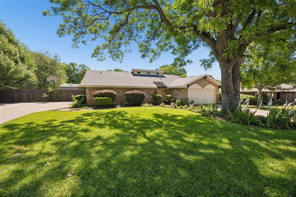 Welcome to this inviting and beautifully landscaped single-story Ranch-style retreat nestled in sought-after Southlake, Carroll ISD with walking distance to Carroll Elementary. Thoughtfully designed for easy, comfortable living, this 3 bedroom home on slightly under half an acre is a gem for many reasons! The wood-burning fireplace, wood floors, updated bathrooms, newer windows just to name of few. The home offers a flex room off the kitchen that could be used as a game room or 2nd home office, an additional room between kitchen and laundry is currently used as a home office. The open layout offers tons of natural light, windows over looking the manicured yard and spacious pool. Outside is where this property truly shines. The spacious, private yard gives you room to roam and space for Barbecue parties with family and friends. One standout feature is the impressive pool and massive deck perfect for entertaining! Home has 2 shed's one features a mini split offering endless versatility, currently used as a workout room but can easily used as a workshop or hobby space. 2nd shed provides space for pool and yard equipment. Garage features epoxy floors and a mini split AC system, keeping it cool all year round! A rare find, with this property you'll never run out of parking space, home has an additional concrete pad just off the side of the home and NO HOA! Schedule a tour today!