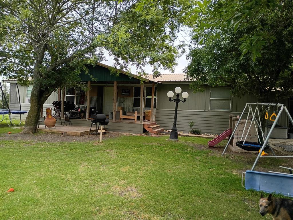 Remodeled double wide trailer on 1 acre.  1 bedroom house in the back.  Large backyard.  Outside of city limits.