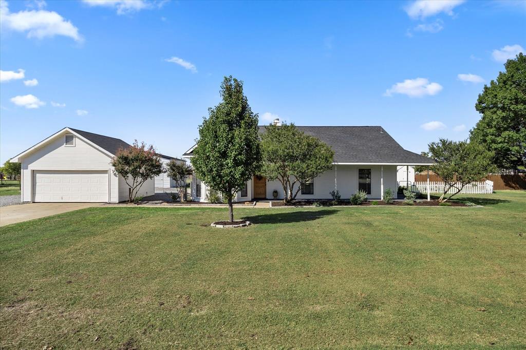 Welcome to this picture-perfect updated farmhouse retreat on 1.3 acres in Lavon, just minutes from scenic Lake Lavon! This inviting 3-bedroom, 2-bath home captures classic country charm with its wrap-around porch and welcoming curb appeal. Step inside to discover a warm, open layout filled with natural light and thoughtful details that make every space feel like home. Enjoy peaceful mornings on the covered back porch overlooking your private acreage—complete with a chicken coop generator and plenty of room to garden, play, or simply unwind. A recently added shop with pull through door, adds incredible versatility for hobbies, storage, or creative projects. Don't miss the extra room for parking!  Whether you’re dreaming of a little homestead or a quiet place to relax close to the lake, this property delivers the best of both worlds. Homes like this are rare—come see it in person and fall in love with the lifestyle it offers!  Check out the virtual tour and floorplan video too!
